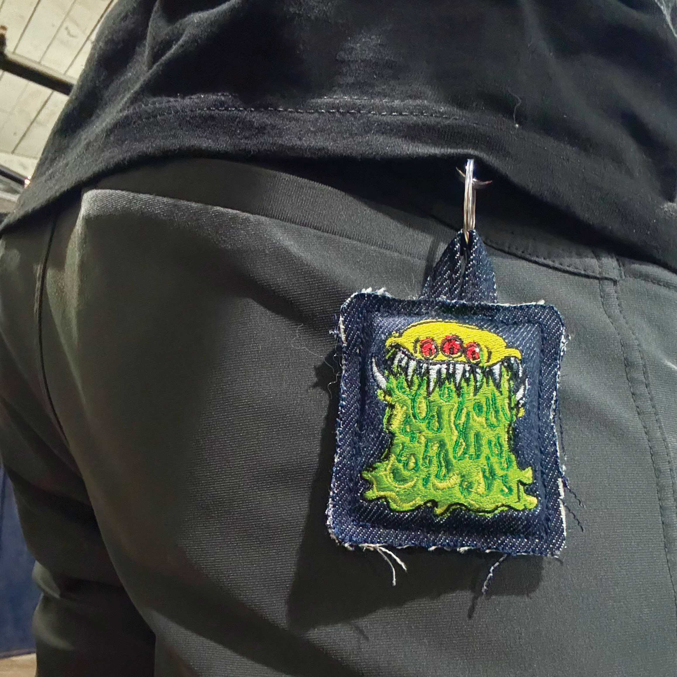 Monster keychain on belt loop.png