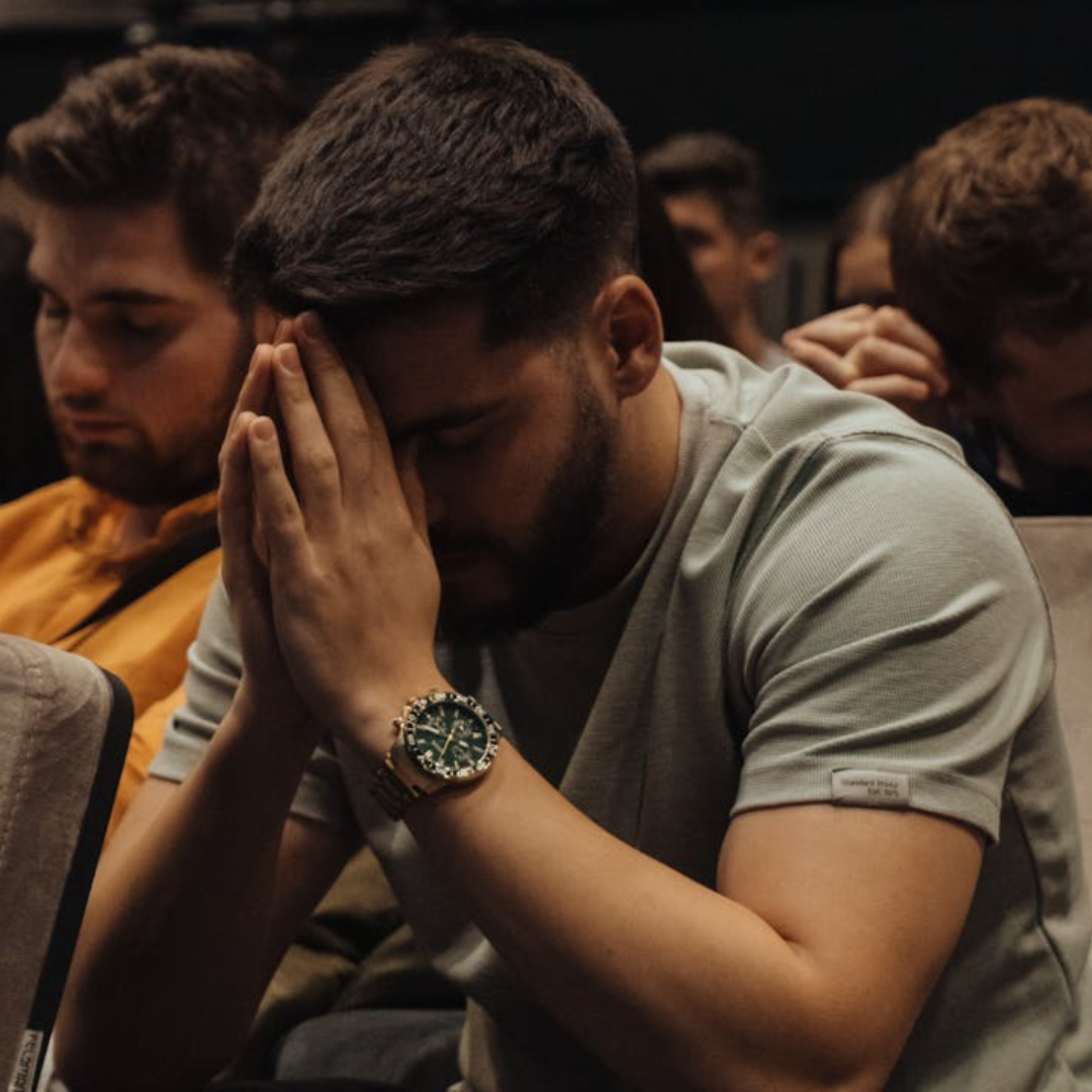 young man praying in church.10 Scriptures To Help Carry The Spirit Of Patience In A Marriage