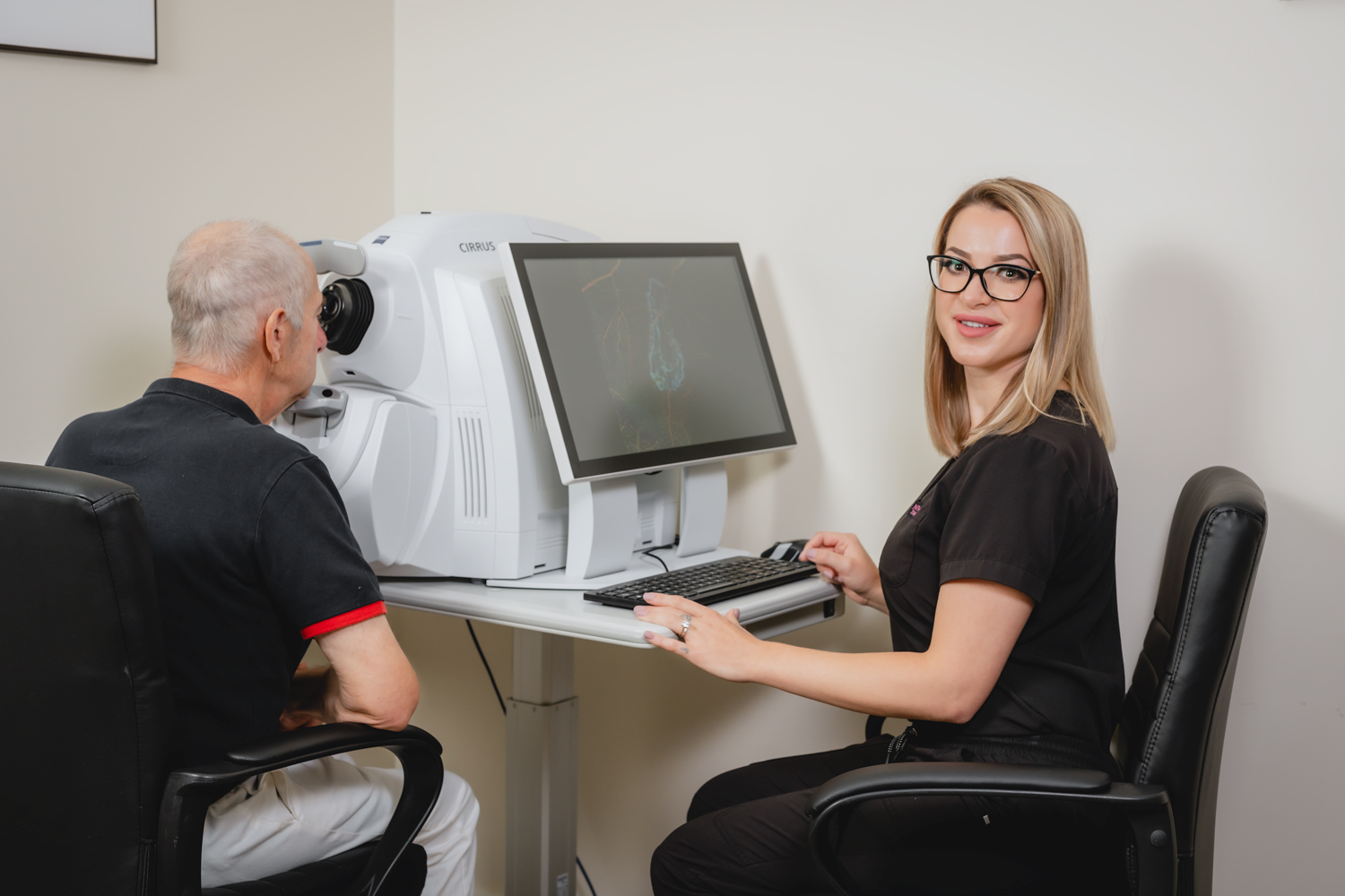 Natalie testing a patient at a Zeiss OCT 6000 machine