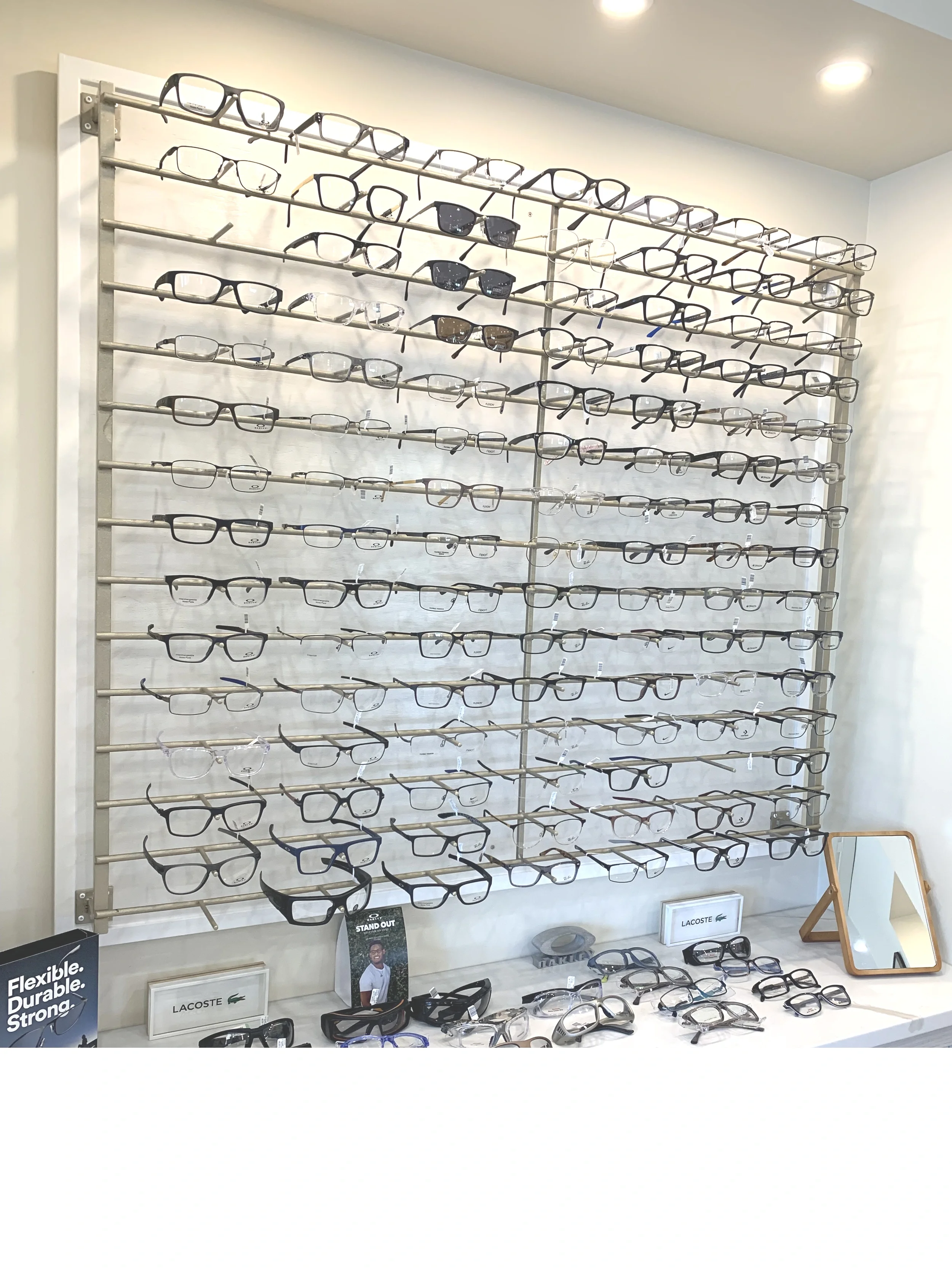 A frame rack full of eyeglasses frames suited for men