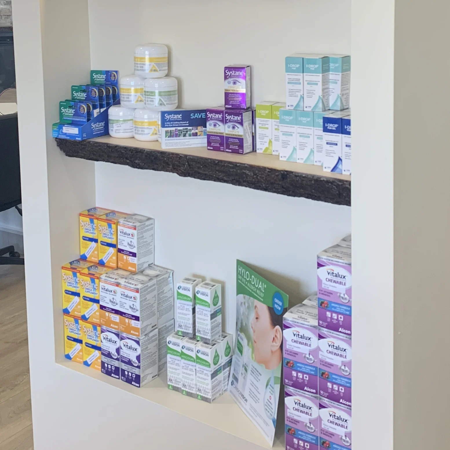 Shelves containing artificial tears, eyelid wipes, supplements, and natural options for eye health