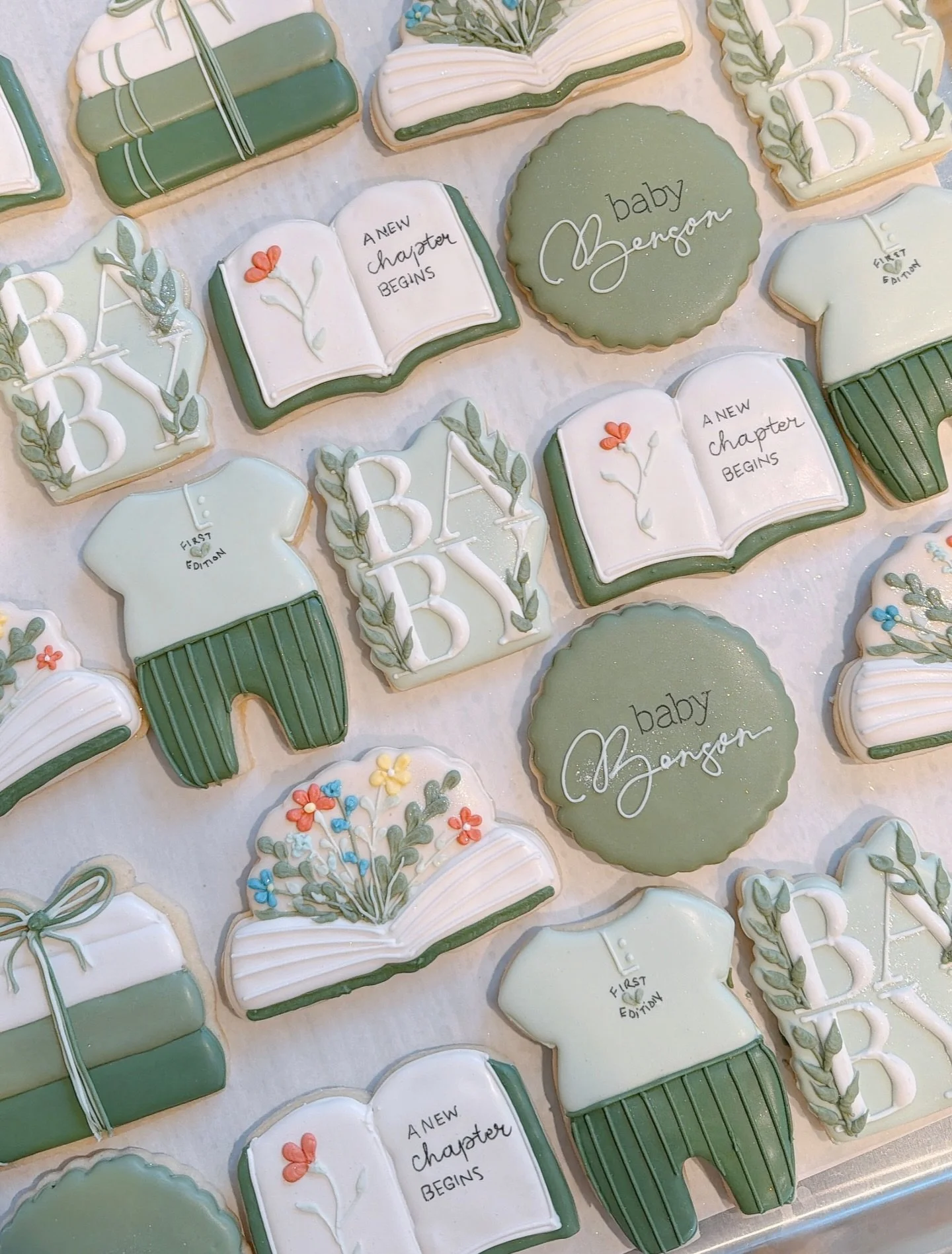 A New Chapter Begins! So excited I got the opportunity to make these for this sweet family. Congratulations on your adoption. 🤍✨🌿

#adoptioncookies #bookcookies #babyshower #bayshowercookies #anewchapterbegins