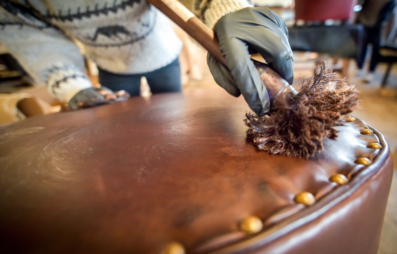  Hand painting the leather with paintbrush 