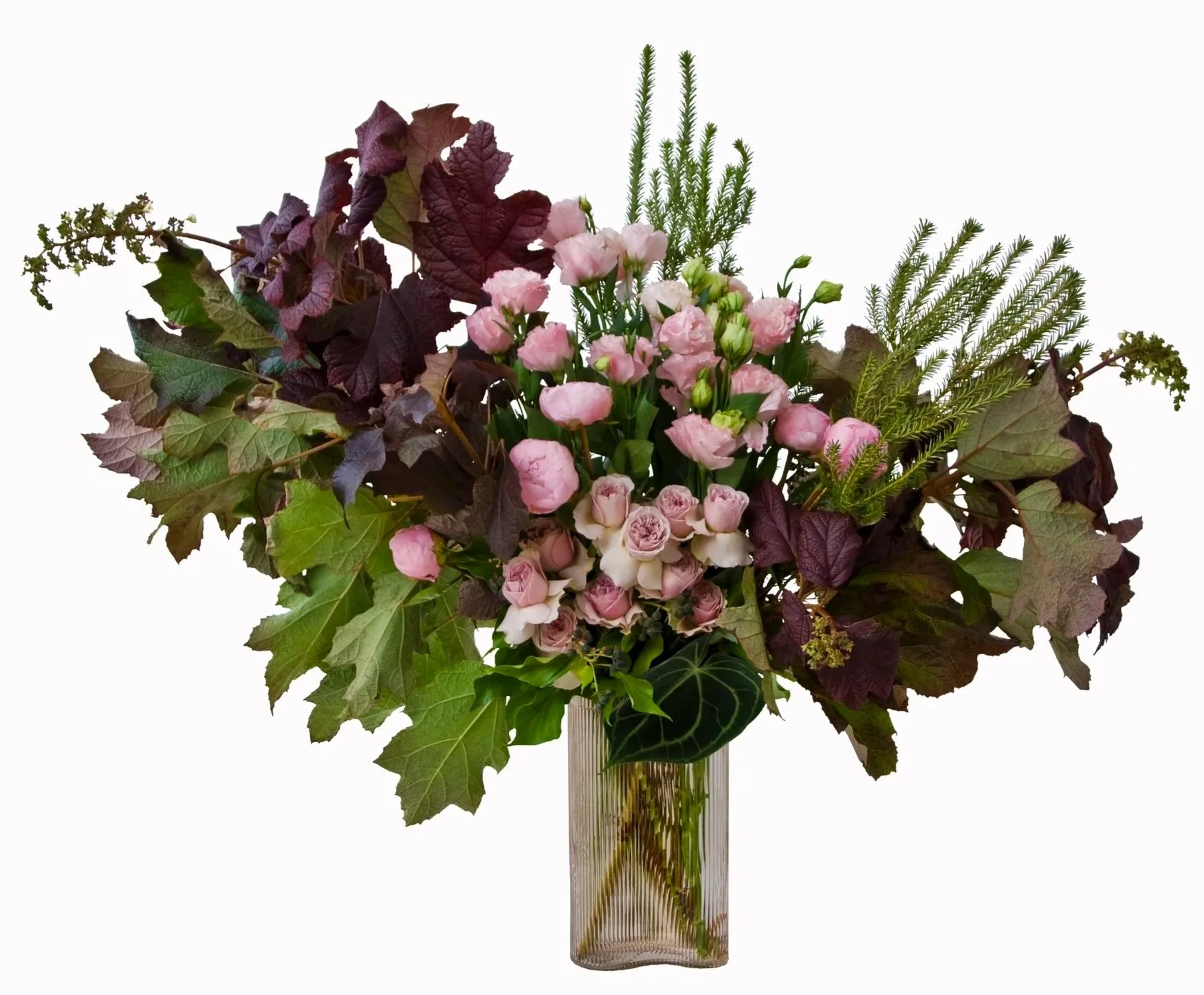 A mixture of seasonal blooms featuring pink classic roses, pink lisianthus, pink paeony, forest pansy foliage and grevillia foliage. Botanic Flowers 1300 820 920.