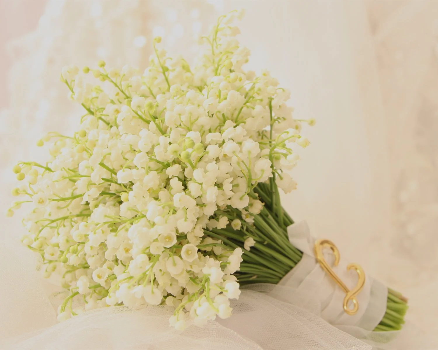 Delicate, fragrant and profoundly elegant, lily of the valley wedding bouquet