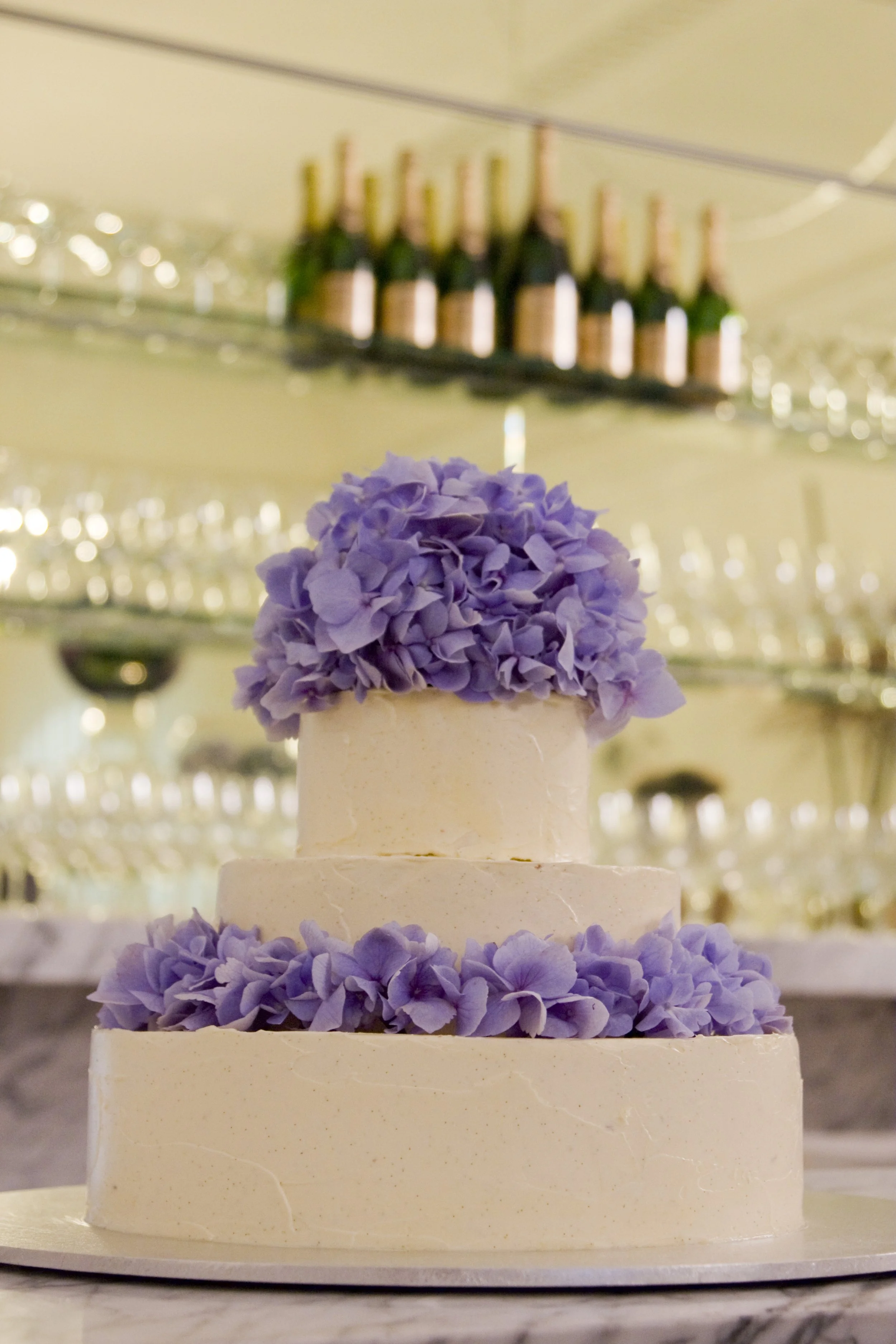 Wedding cake featuring blue hydrangea