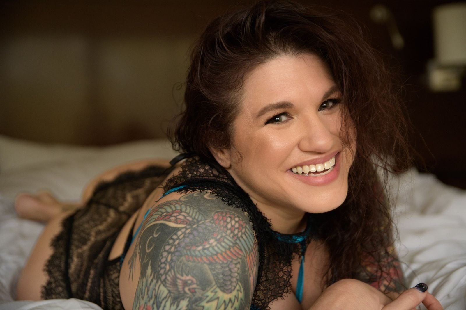 Jen Jackson smiling during her own boudoir session