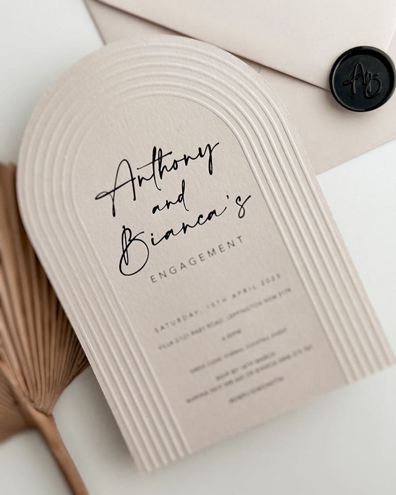 Embossed and letterpress arch wedding invitation