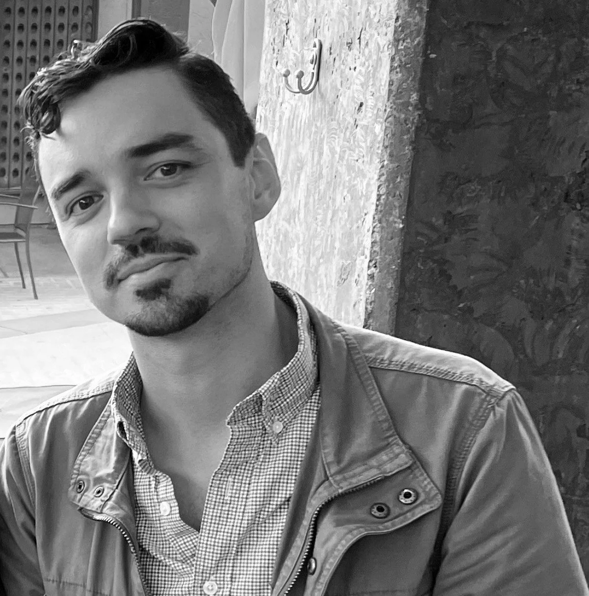 Black and white portrait of Alex Hayes, Board Member.