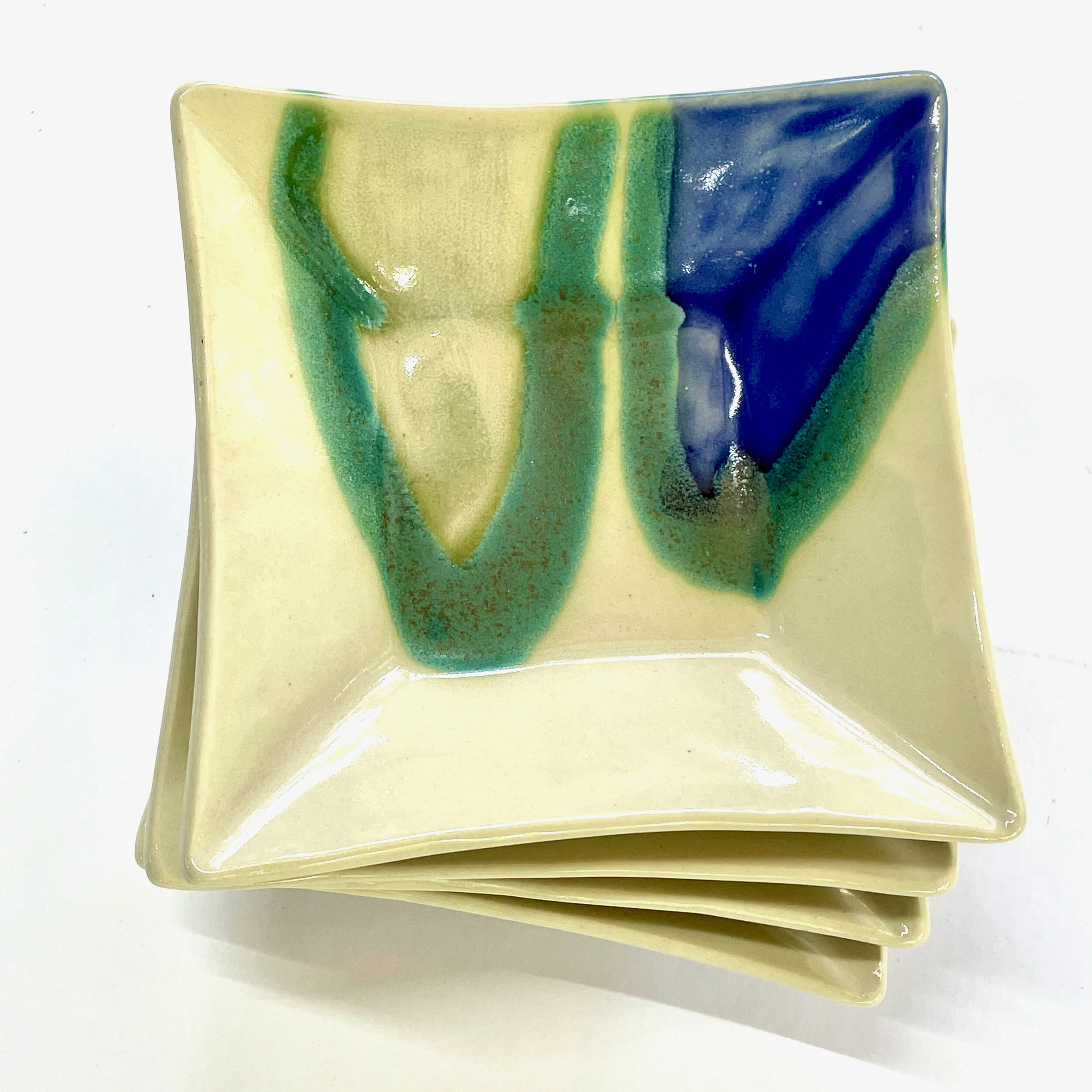 Square Desert dishes with feet, $22