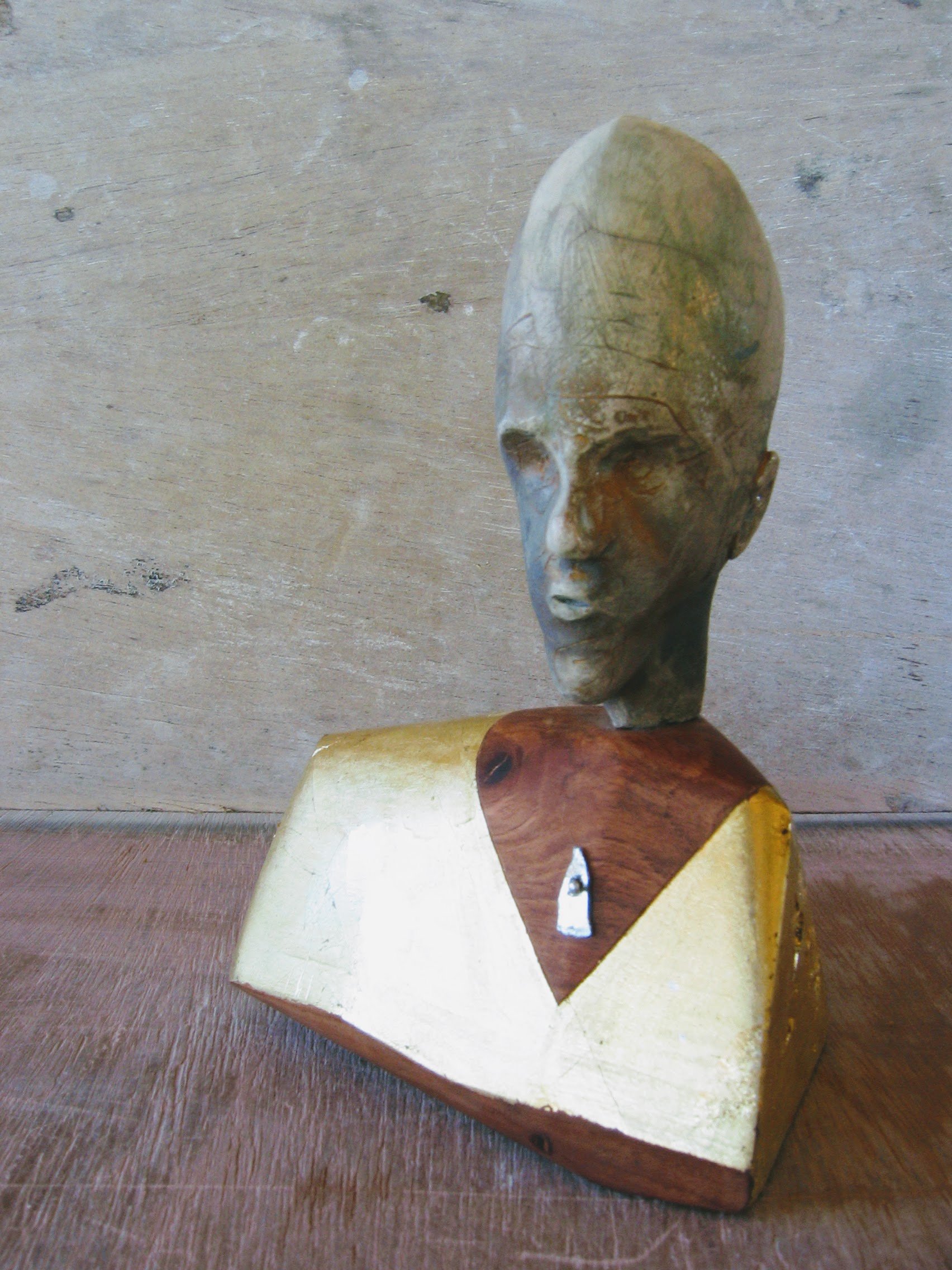 Bling. Clay, metal, wood and gold leaf.