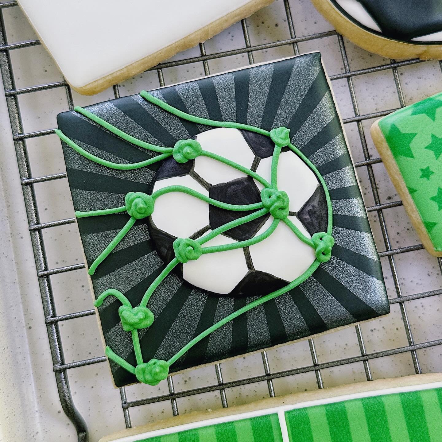 Soccer shots - closeups. ⚽️
This was a fun set to make. I always like the high contrast colors and a pop of green.

#atlantacookies #customcookiesatlanta #atlantacookier #atlantacustomcookies #atlcookies  #cookiesatl #customcookies #decoratedcookies 