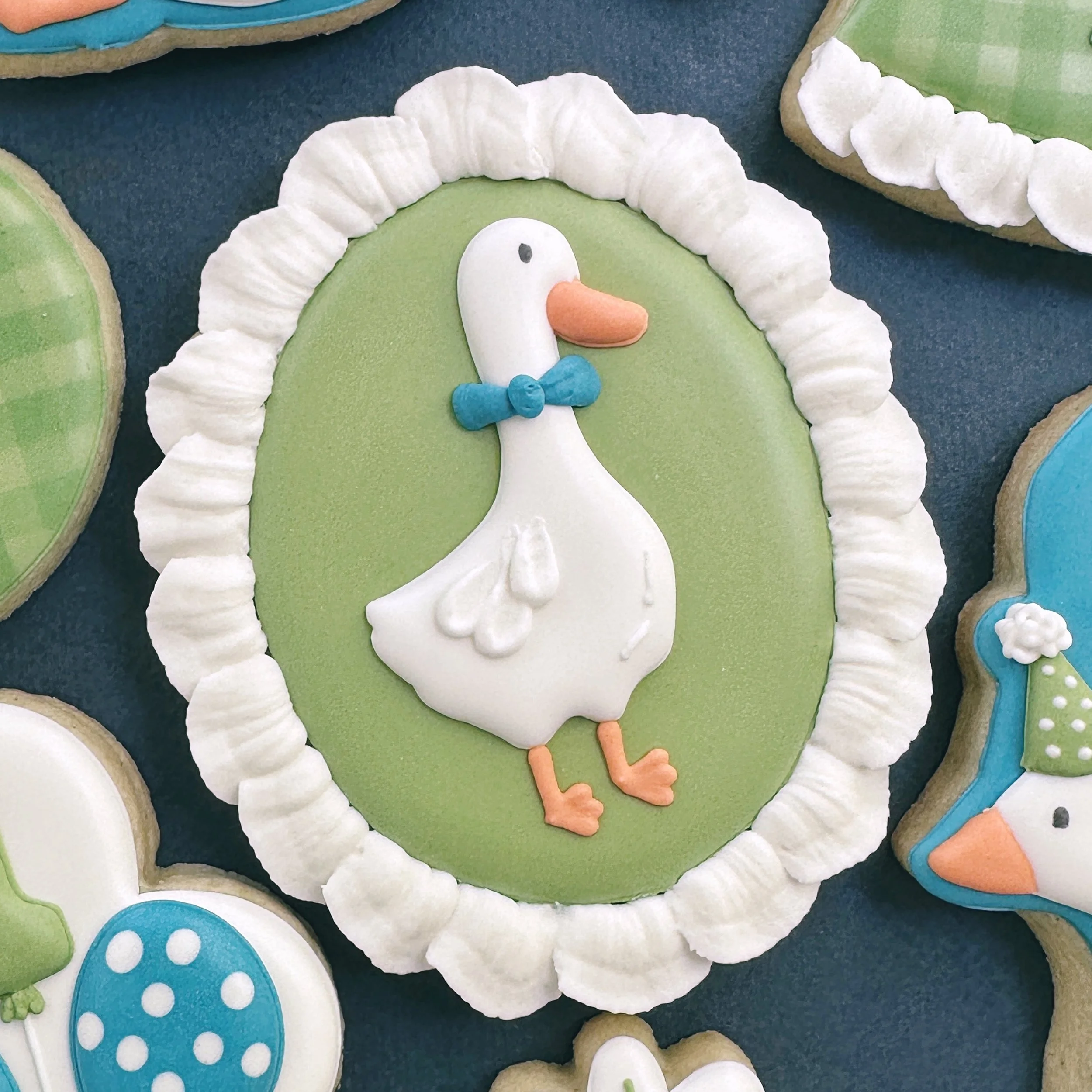 It&rsquo;s tough to choose the goose I prefer but I loved this guy with his bow tie. 
Silly goose closeups. 

@adrianagisela_ 
#firstbirthdaycookies #onesillygoose #onesillygoosecookies #atlcookies #customcookiesatlanta