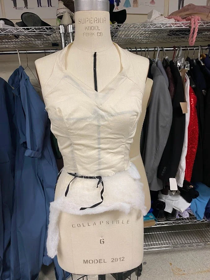 A muslin mockup of the bodice with the yoke/halter pieces