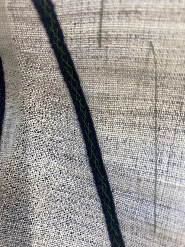 A close up of the roll line stitching