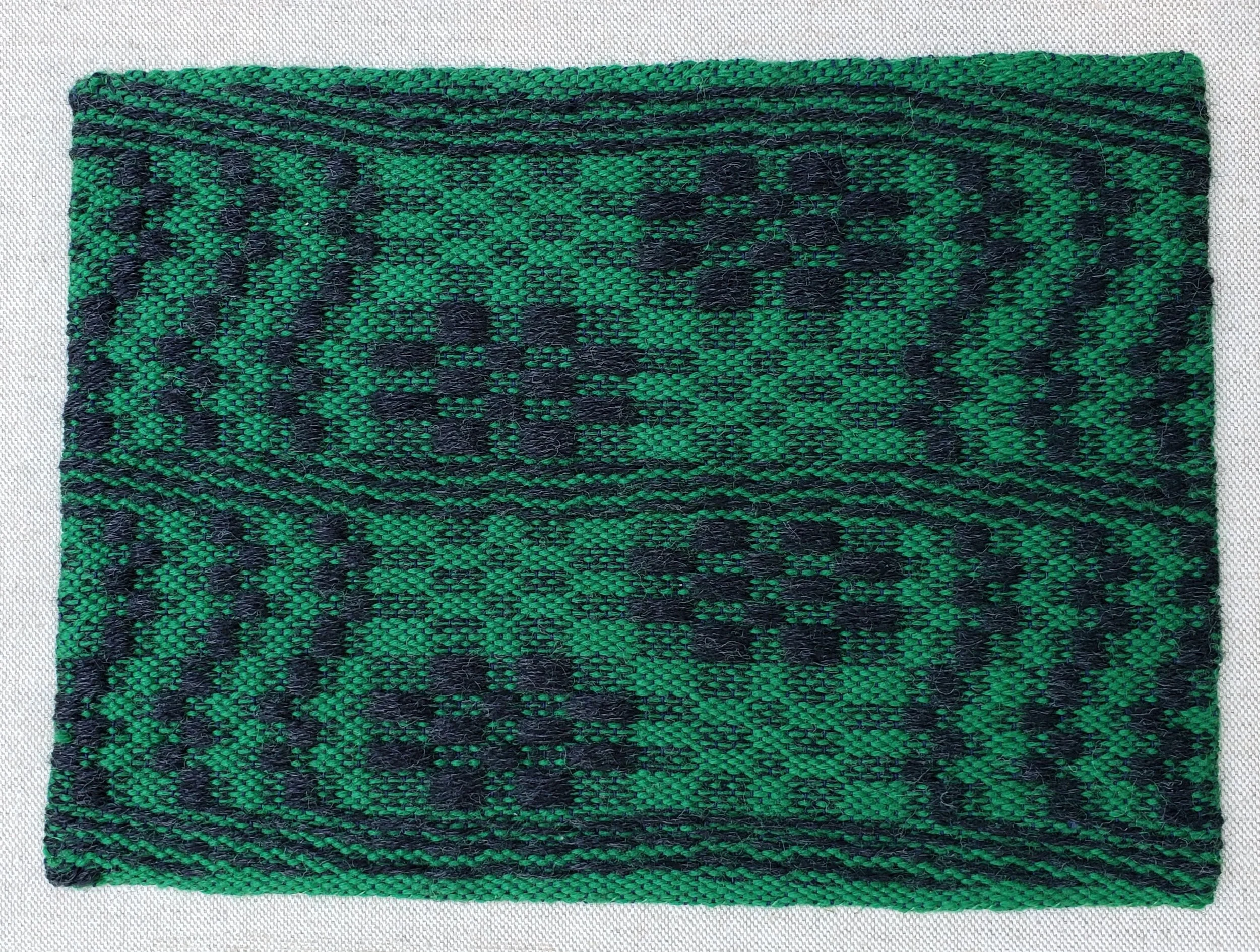 Woven in response to Answering the Mountains call. Cat Track & Snail Trail with Emphasis on Cat Track (2026) woven in response to The Left Cat by A. p. Harbor from The Hum of a Dreaming Moon. 9"x12" wool and acrylic on linen canvas, traditional Kentu