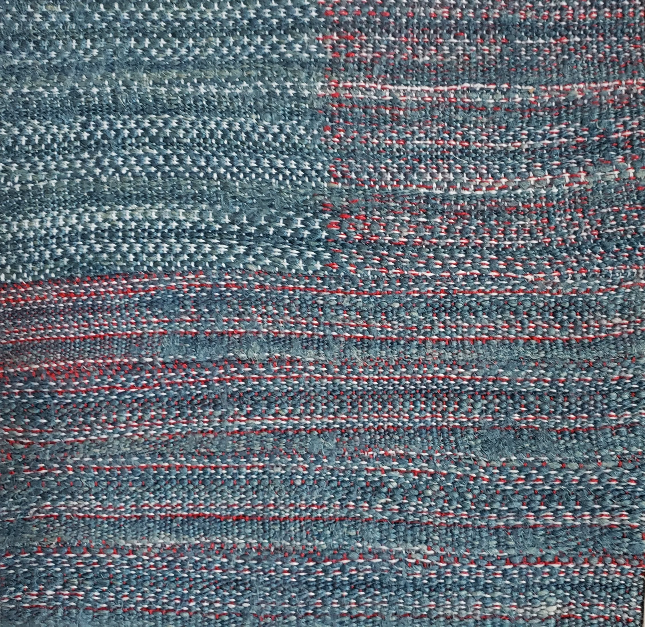 Weave Across America coverlet project, 2026. Statement: I reimagined the flag set against a rough spun linen, dyed with Metcalfe County, Kentucky grown fress leaf indigo. Theis rustic piece reflects the resiliency of our people. Fresh leaf indigo dye
