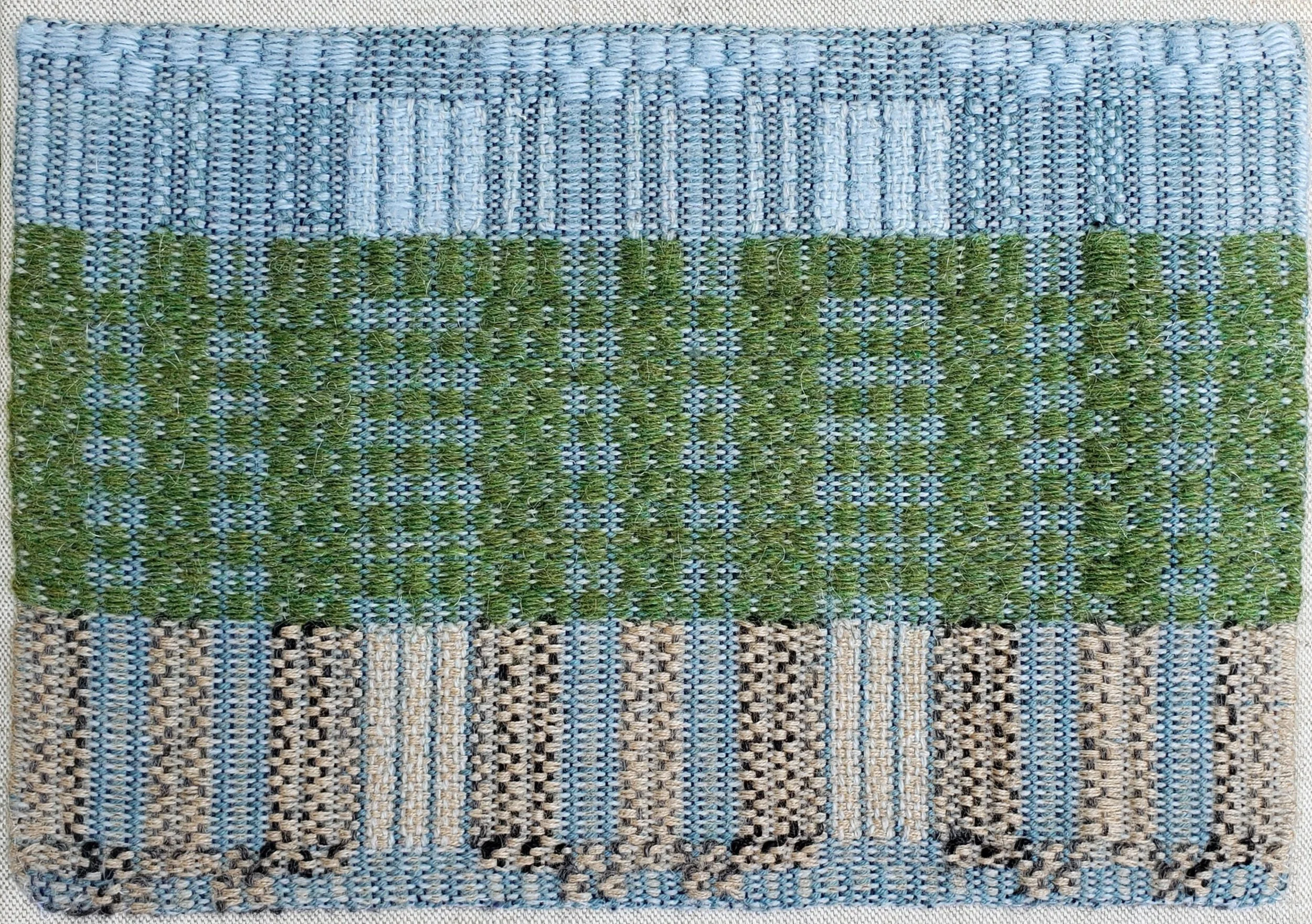 Woven in response to Answering the Mountains call. Contemporary Pine Tree Boarder (2026) in response to Amy Le Ann Richardson's I Turn to Trees from Out of Places. 9"x12" synthetic fibers and wool on linen canvas, traditional Pine Tree Boarder draft 