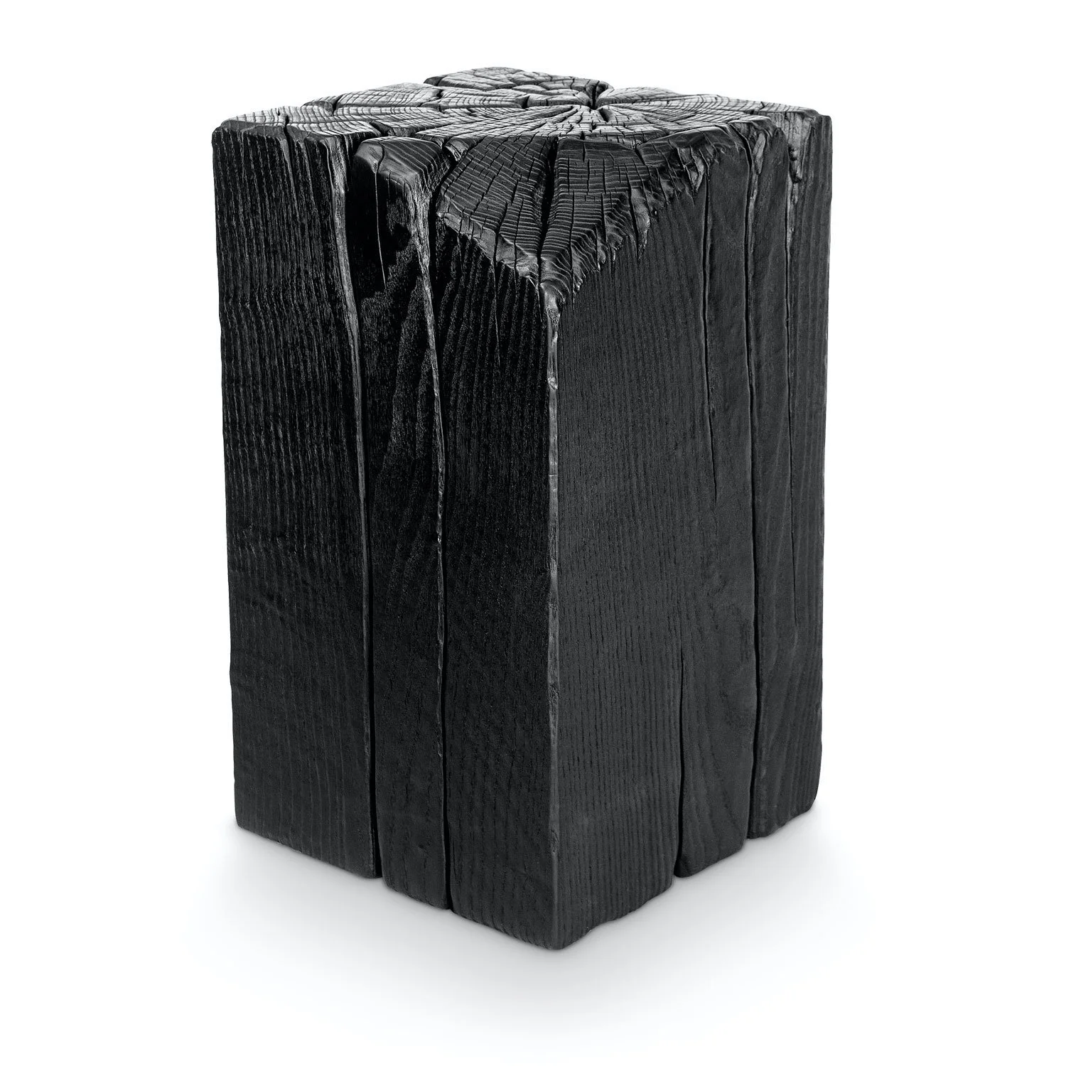 A blackened, charred wooden block with visible cracks and a rough texture.