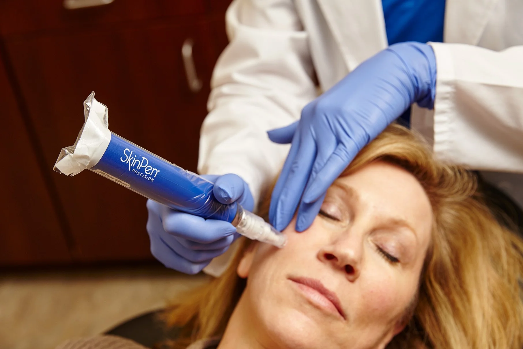 A client receiving a SkinPen microneedling procedure from a professional at Provenance Aesthetic & Wellness in Missouri City.