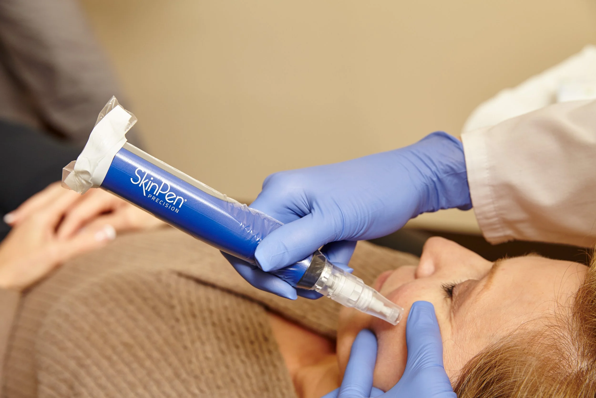 A client receiving a SkinPen microneedling procedure from a professional at Provenance Aesthetic & Wellness in Missouri City.