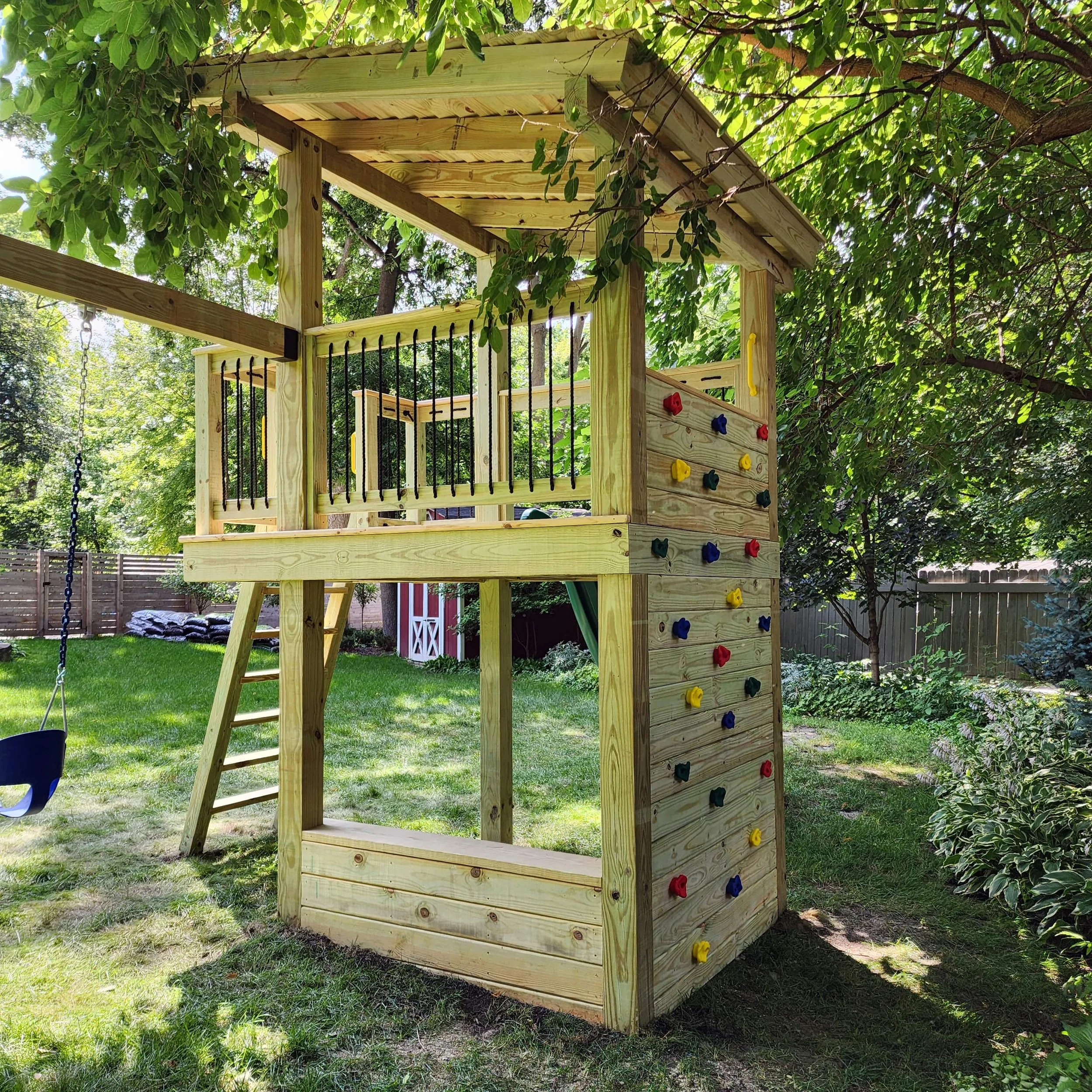 custom backyard swing set parent bench and rock wall