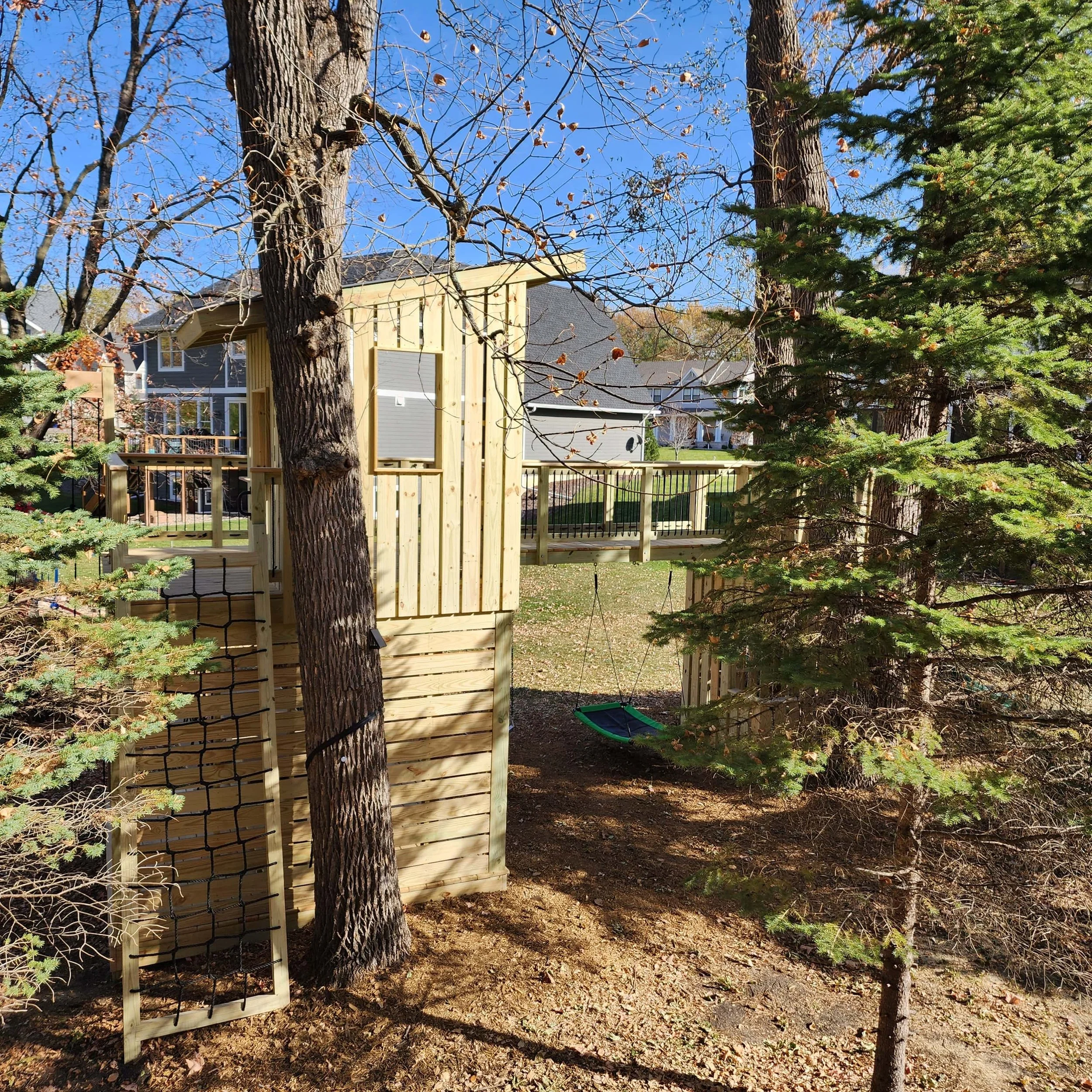 custom tree fort clubhouse with treated lumber