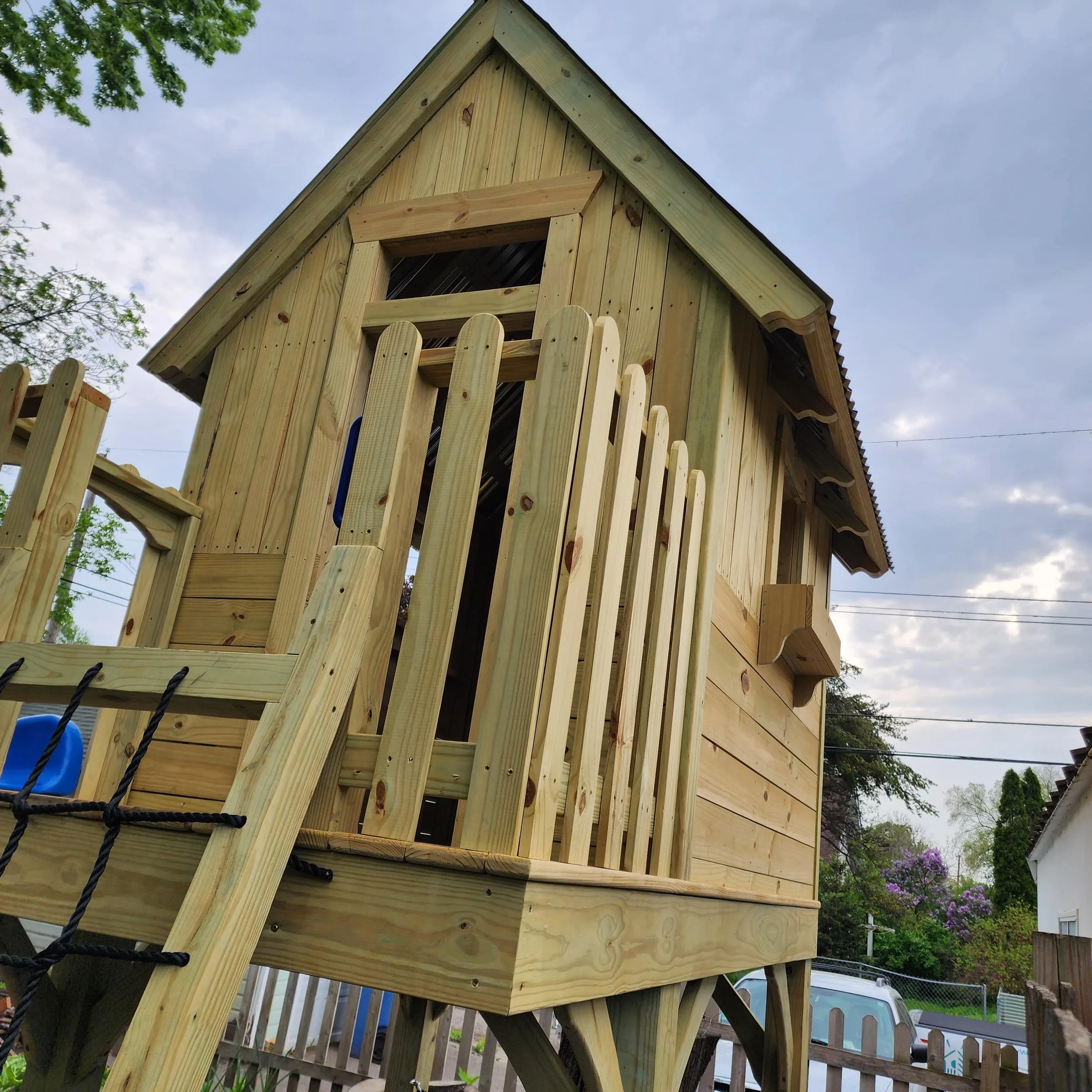 custom play structure with round top railings