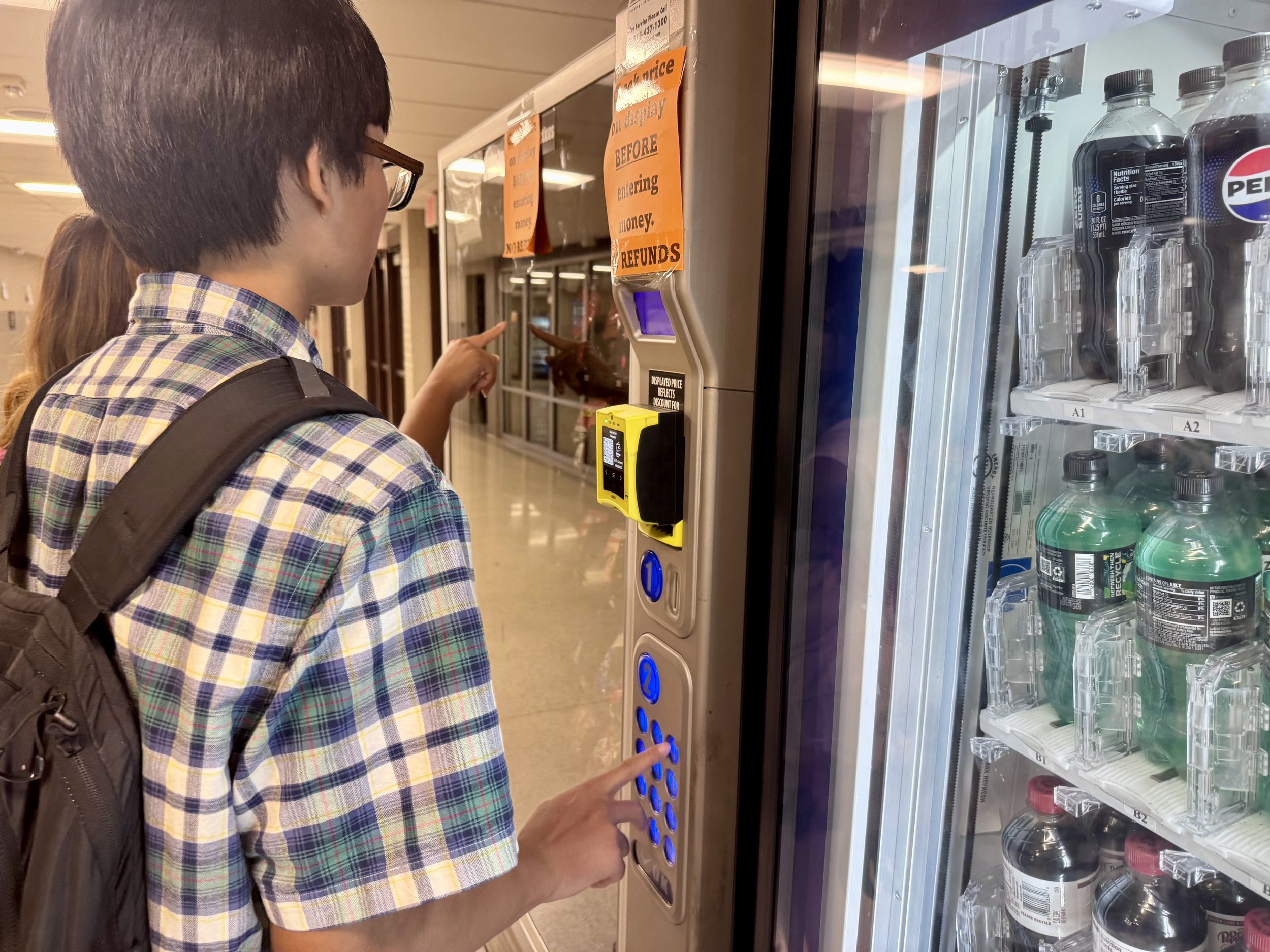 teen boy at vending machine