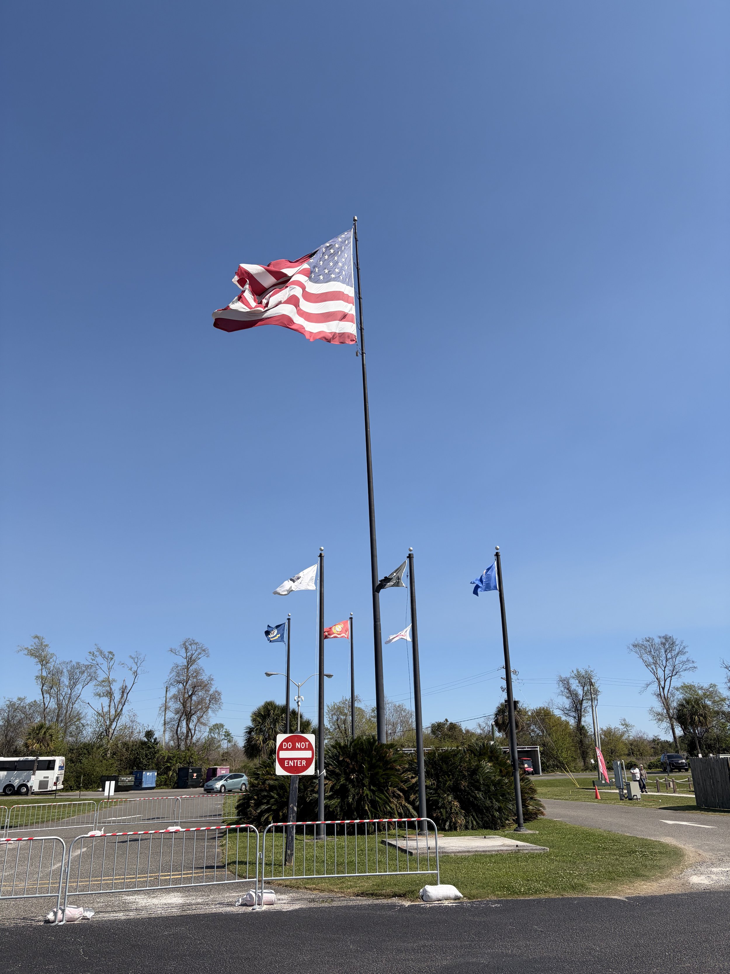 Six flags waving in the sky.