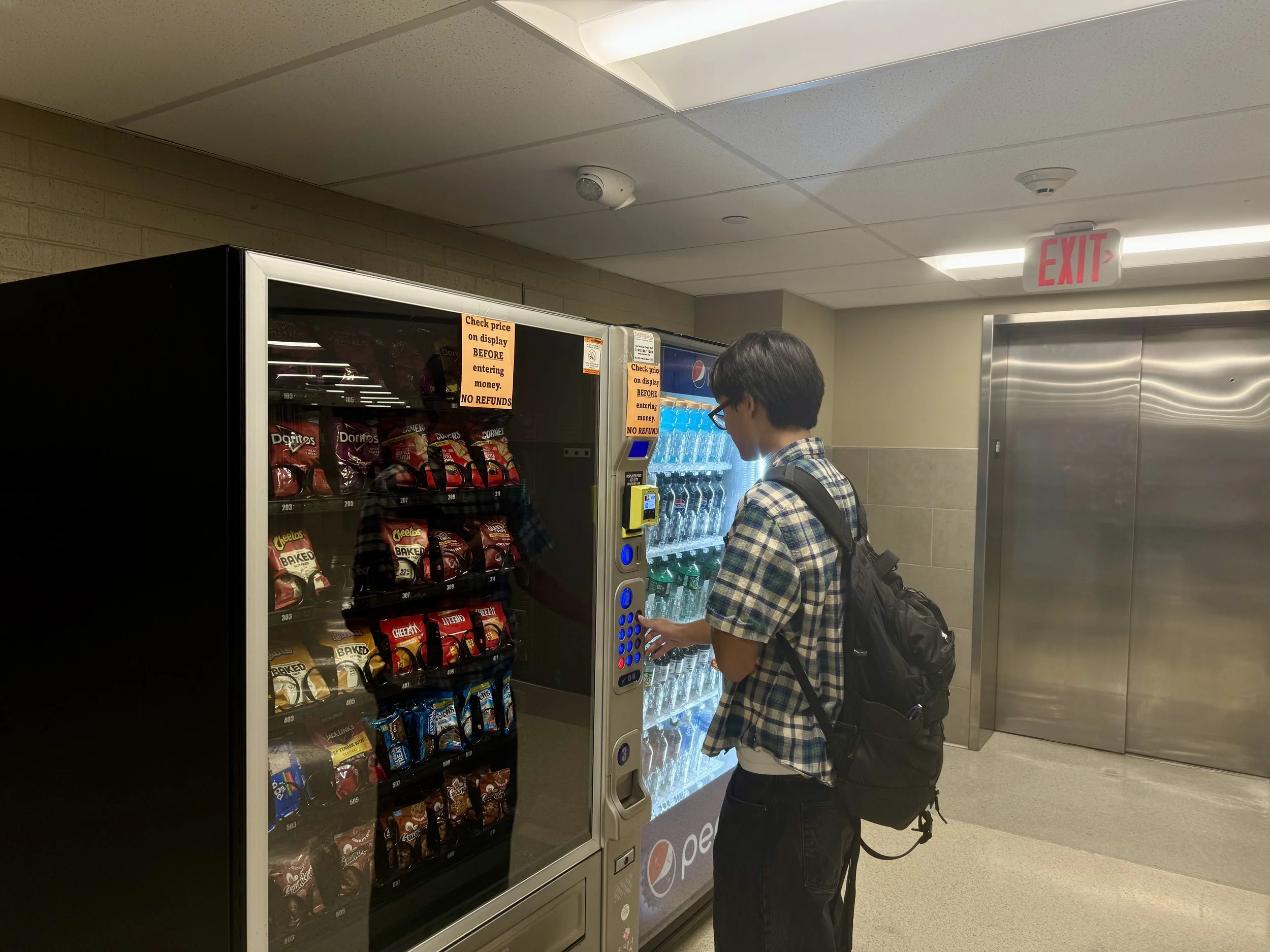 teen boy at vending machine