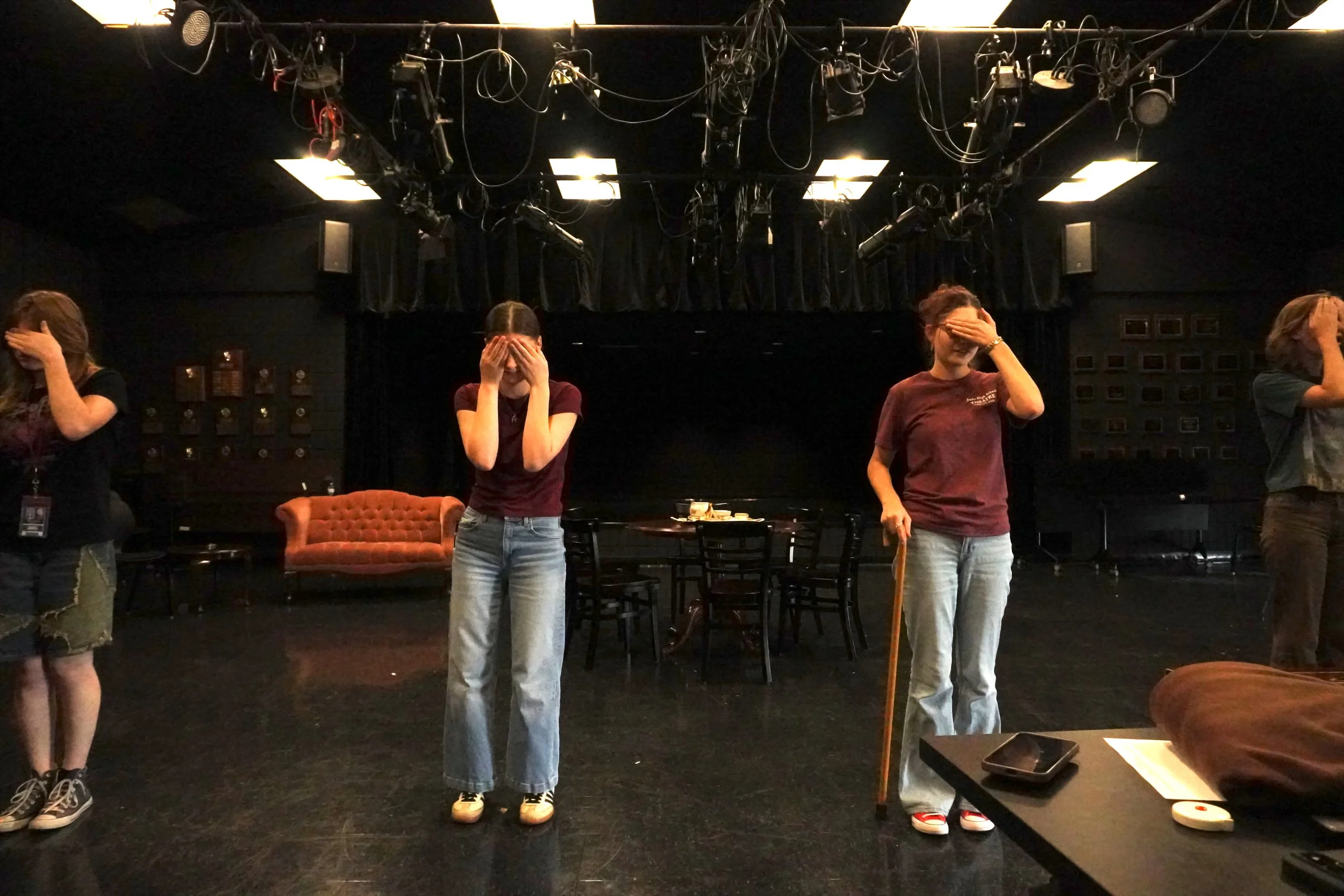 four women stand in a line