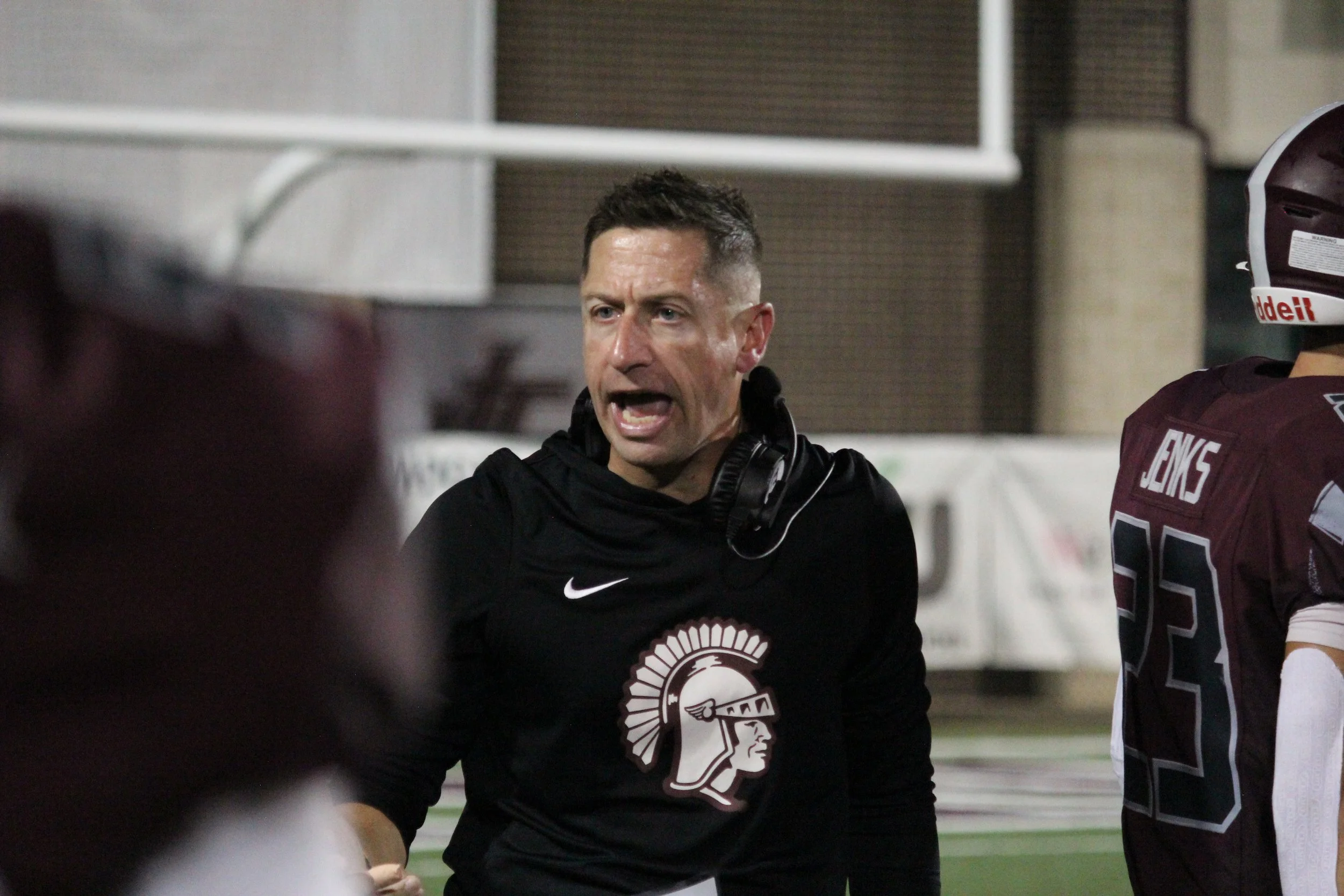 Coach yelling towards the sidelines