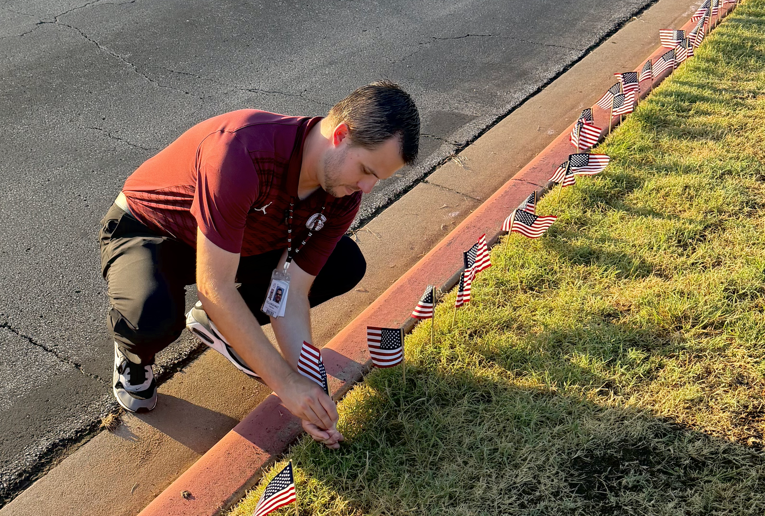 Tillinghast planting a flag