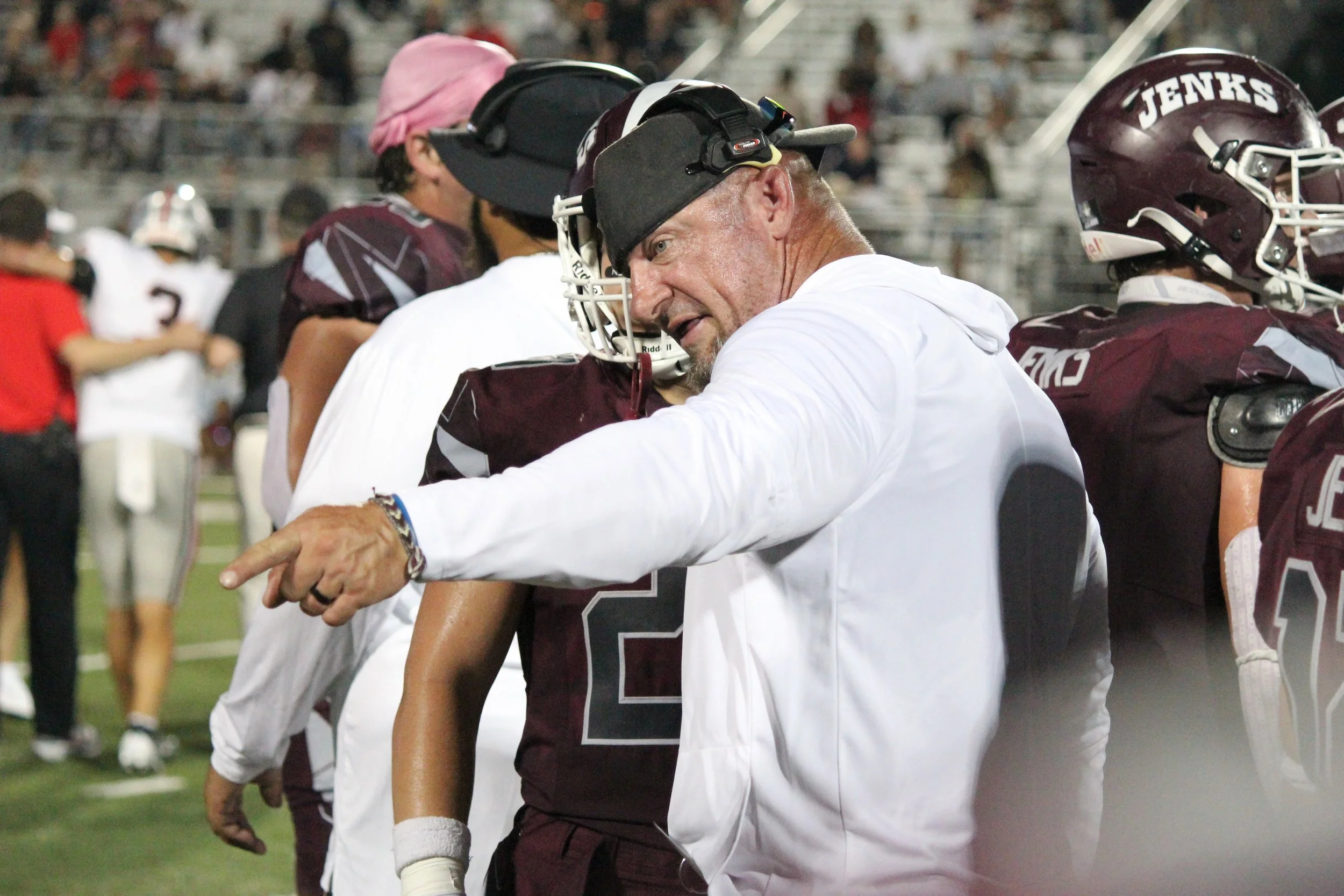 Coach talking to player