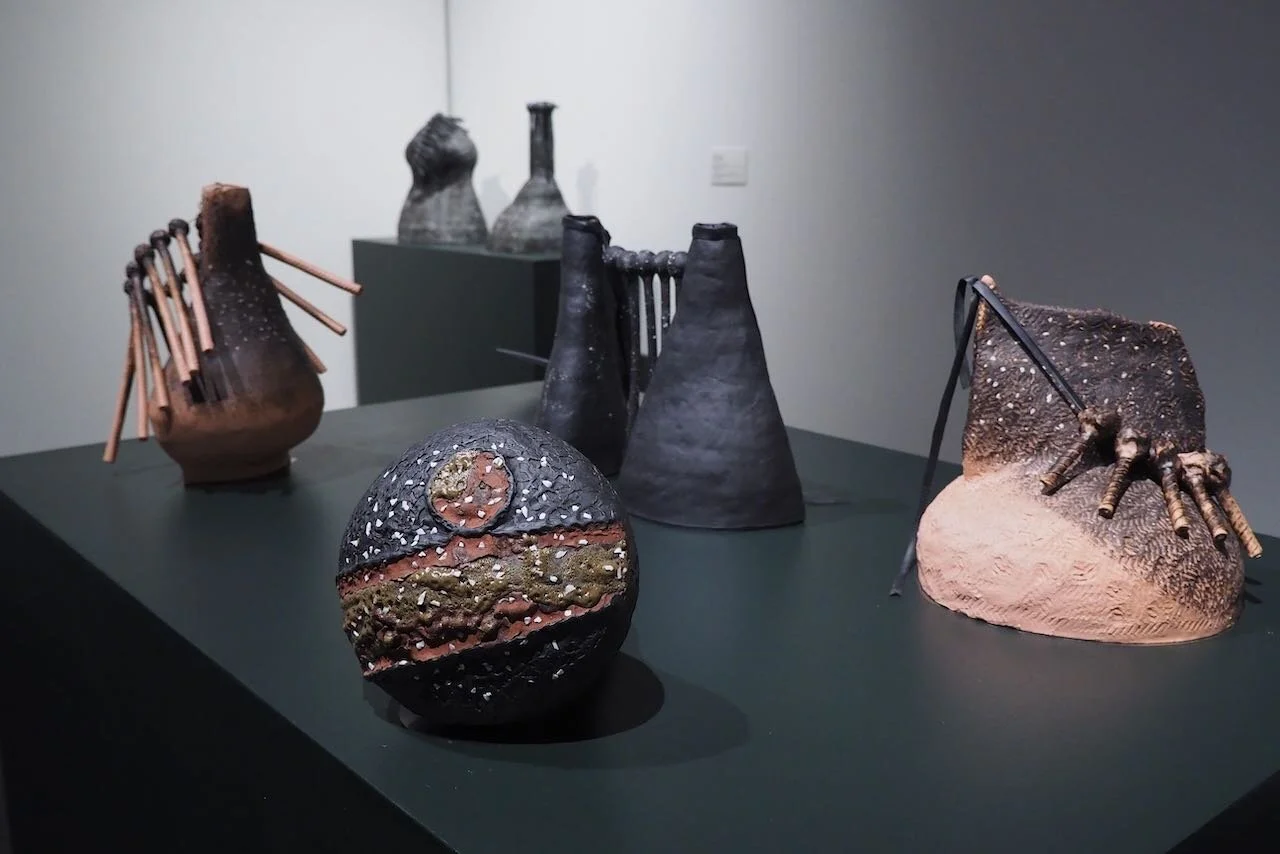  [center]  Mourning Ware (Layers) , 2021; inherited crushed dinnerware embedded in purchased clay, layered with gleaned clays from Niland, CA and Houston, TX 11 in. x 10 in. diameter 