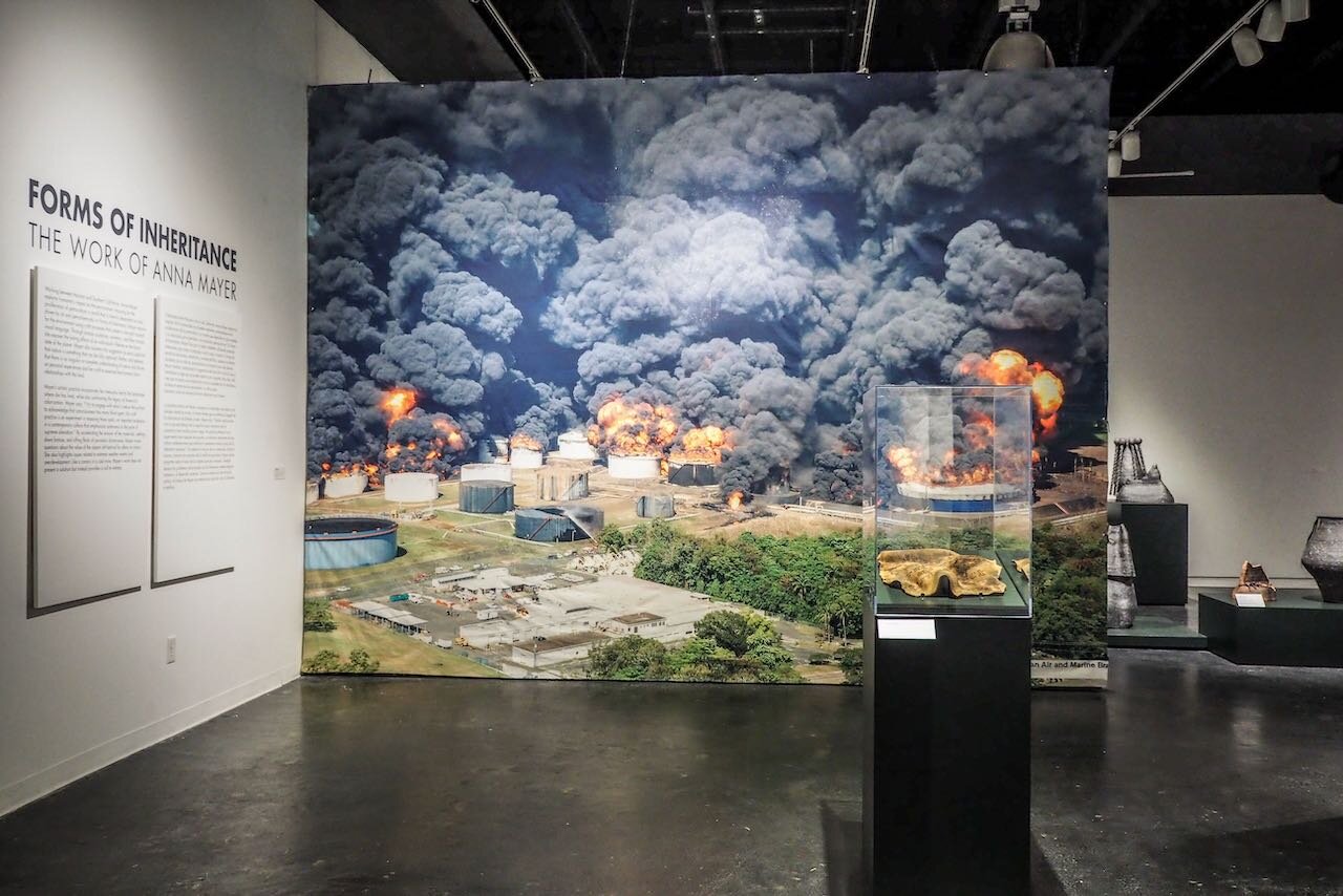Installation view. Background: Caribbean Petroleum Fire Near San Juan, Puerto Rico in 2009 , 2021; printed fabric with holes created while crushing inherited dinnerware; 193 x 144 inches