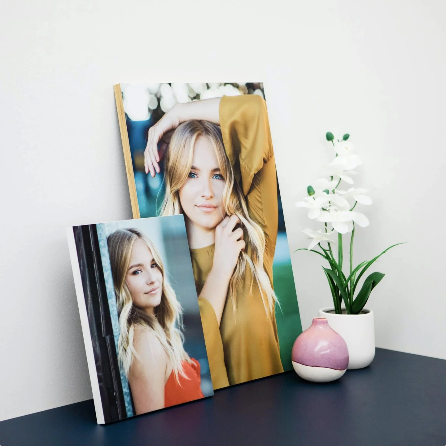 whcc_white-and-light-wood-edge-standout-prints_lifestyle_leaning-tabletop-display.jpg
