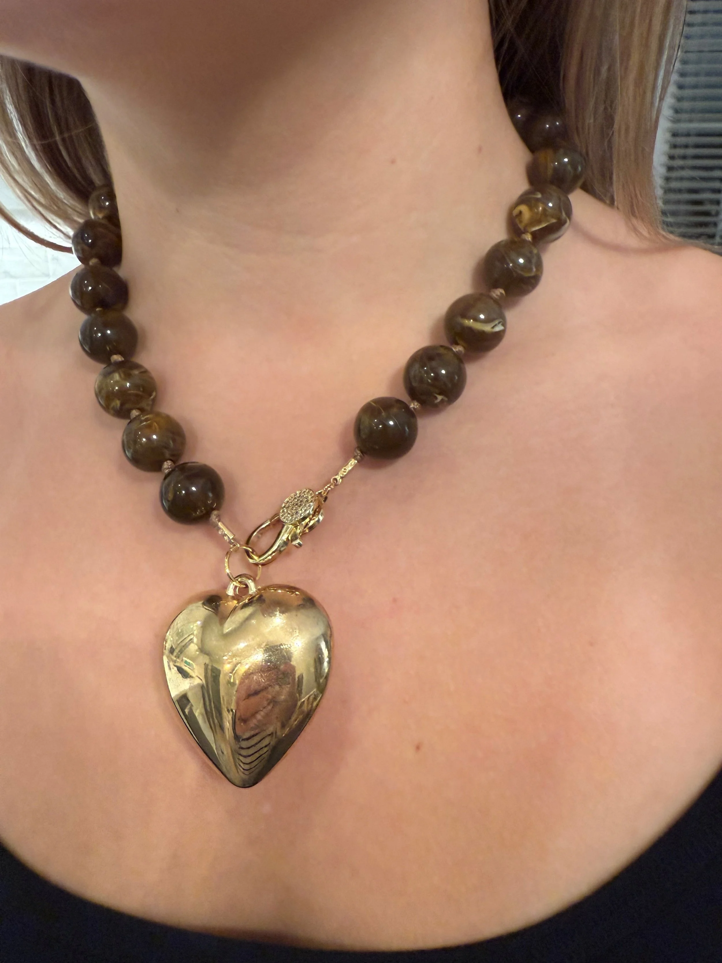 18” brown resin knotted necklace with gold enamel heart
