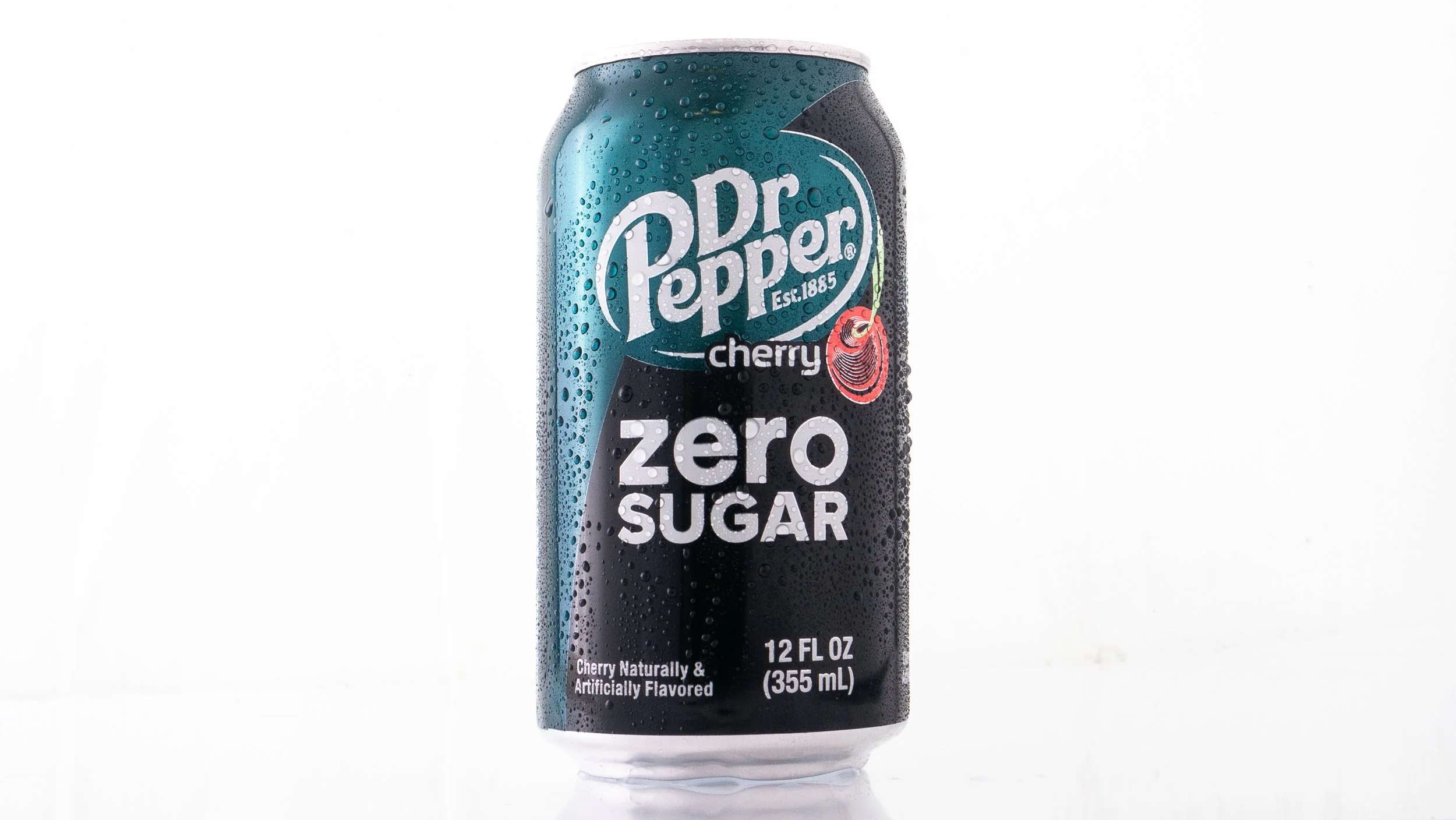 Can of Dr. Pepper Cherry Zero Sugar with condensation on the surface, standing against a white background.