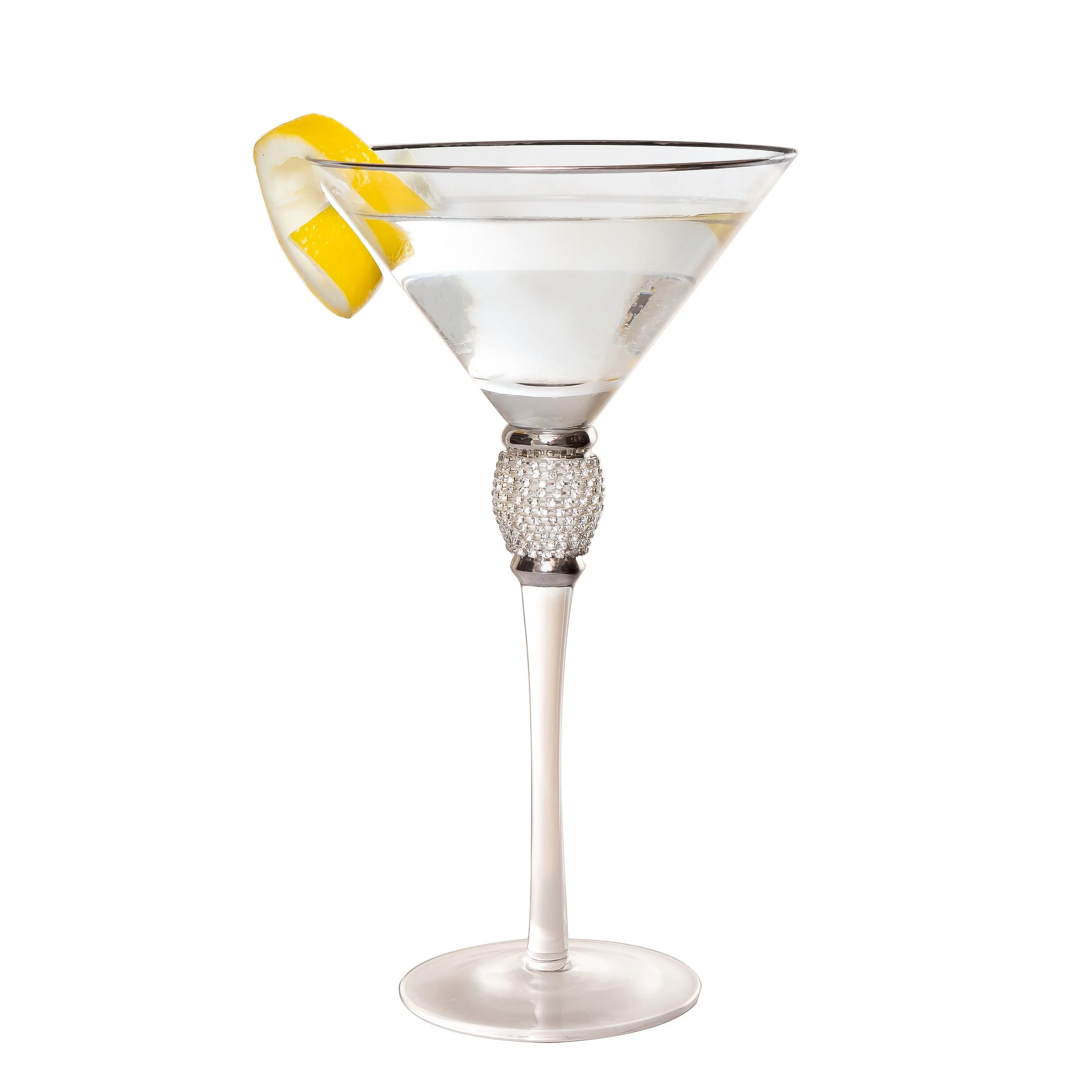 A clear martini glass with a decorative rhinestone band, filled with a clear cocktail, garnished with a lemon wedge on the rim, set against a white background.