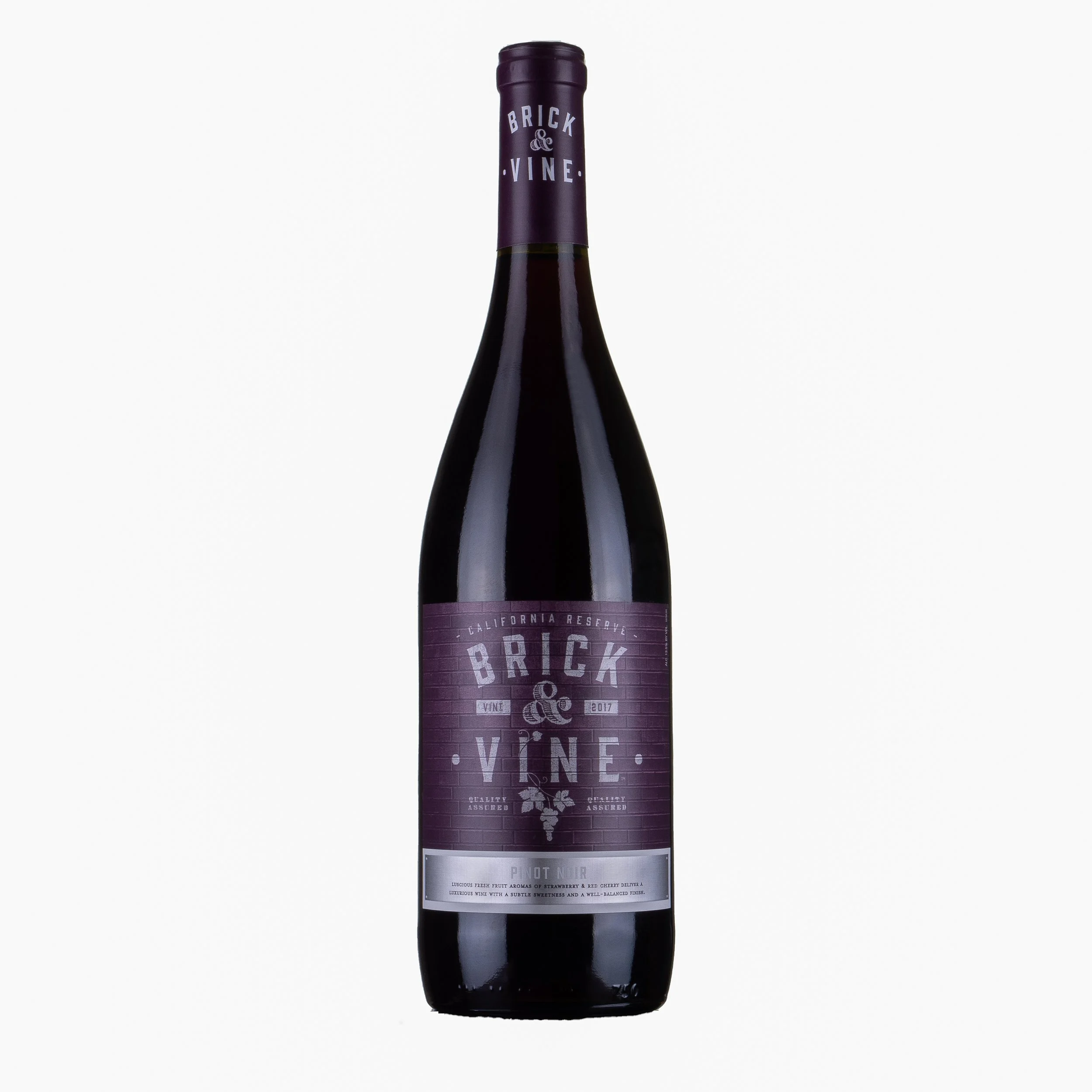 A bottle of Brick & Vine California reserve Pinot Noir wine with a purple label and matching cap, positioned against a white background.