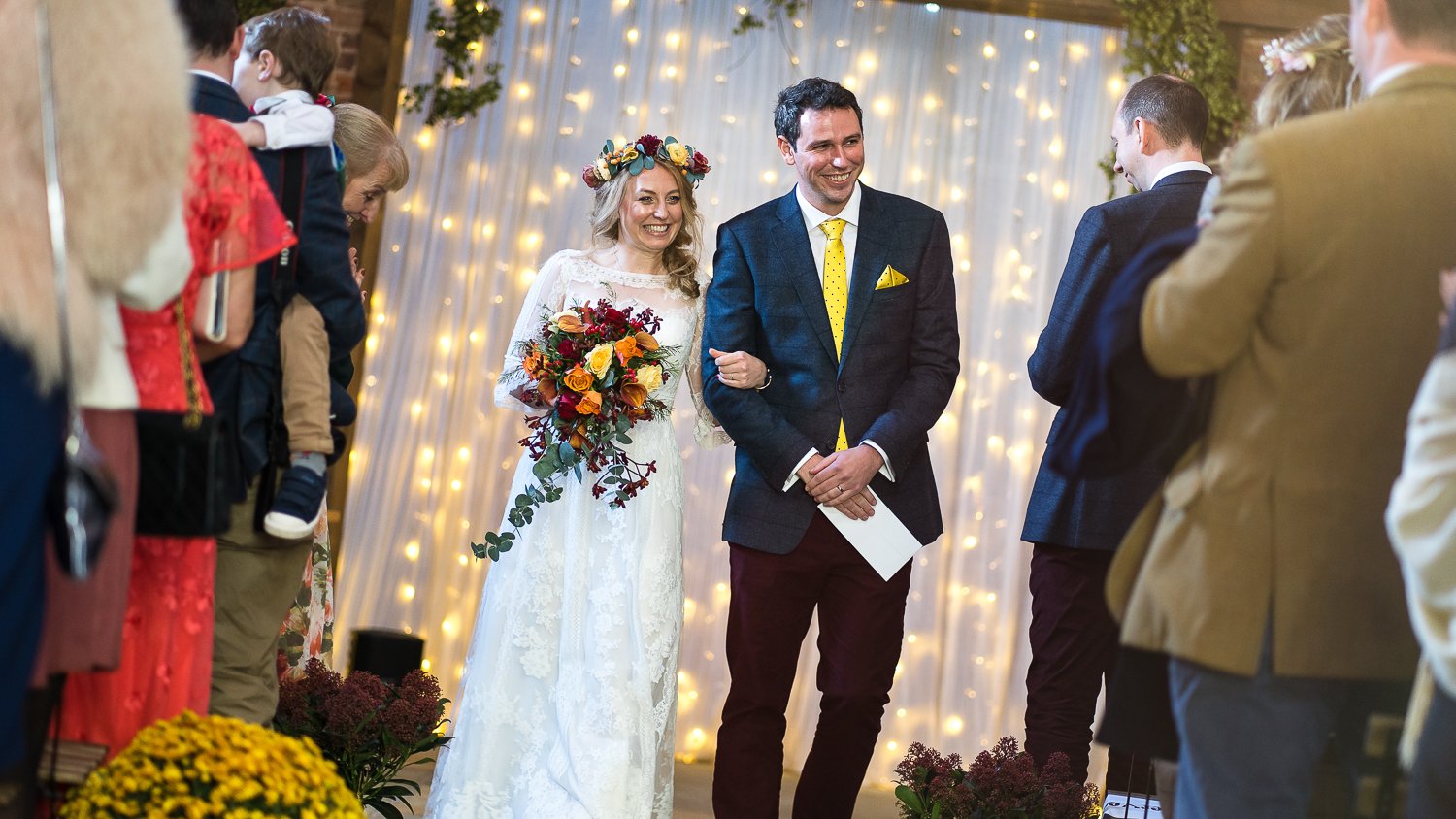 Newly weds walk down aisle happily married