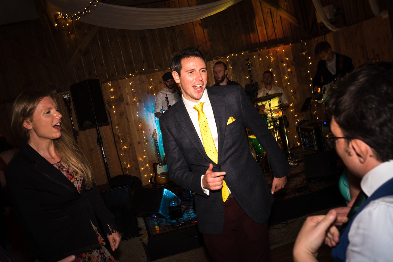 Groom dances to live band at East Yorkshire Barns