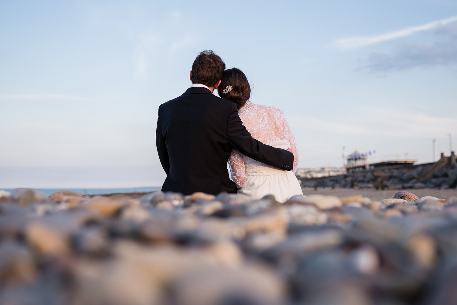 Couple sat on pebbles during beach wedding in Hornsea near Hull (Copy) (Copy) (Copy)