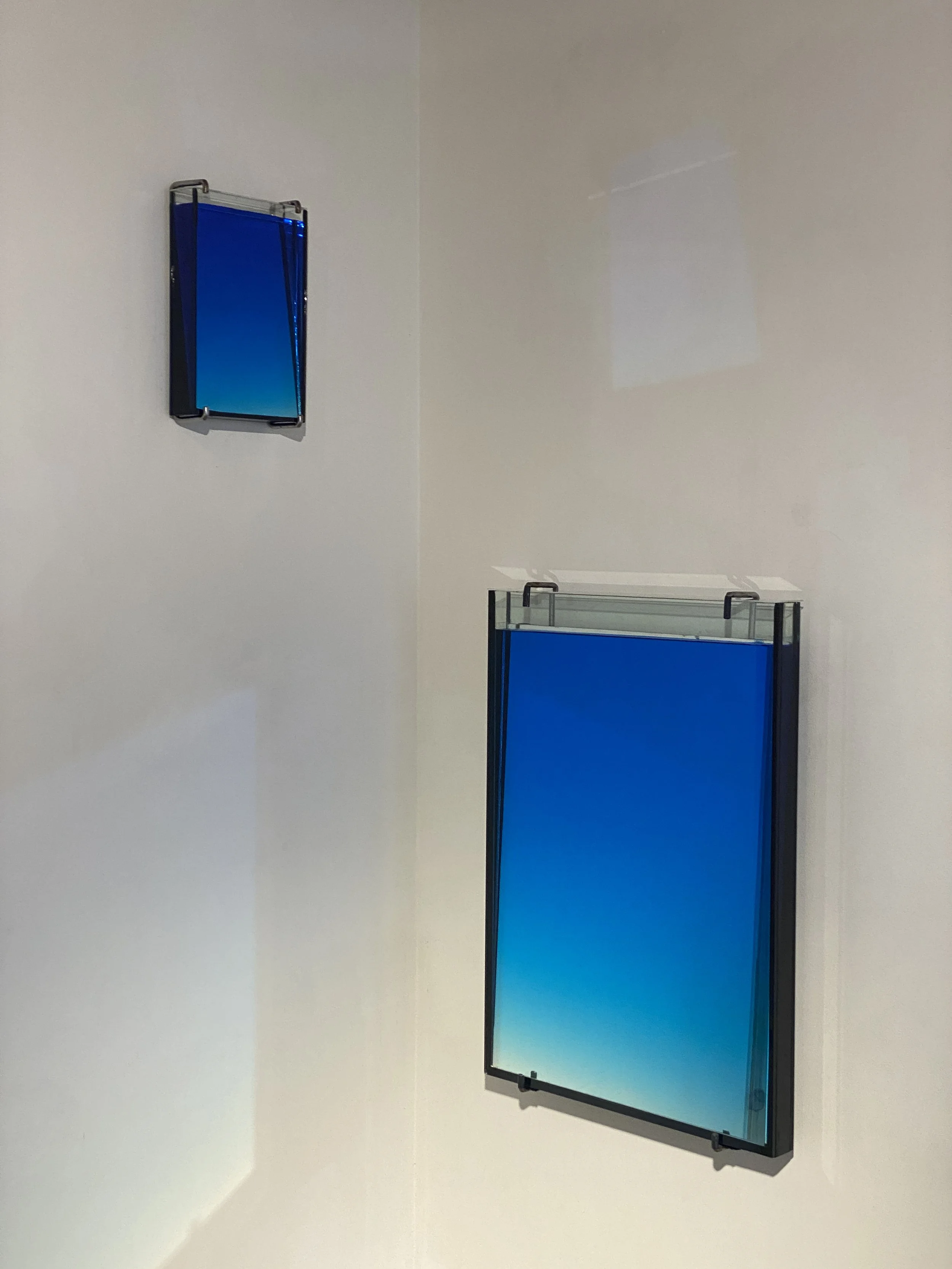 Tilted Mirror in an Aquarium Filled with Blue Water