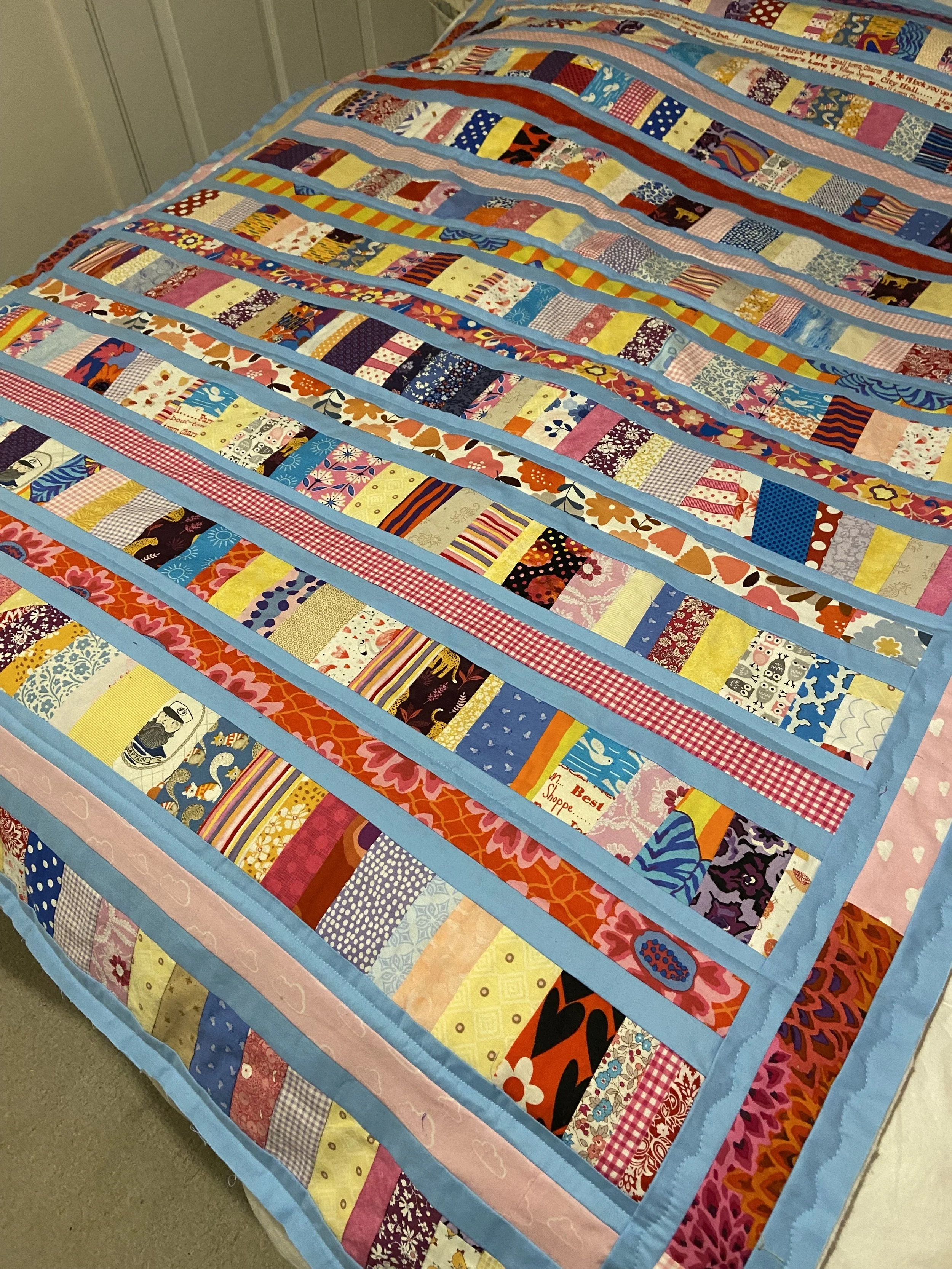 Clare Scrappy Quilt.jpeg
