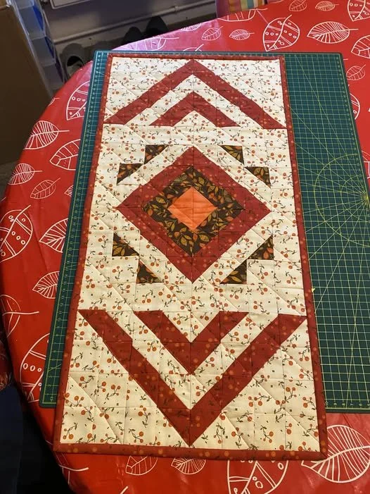 Roaring Radiance Table Runner by Sheila Bulley