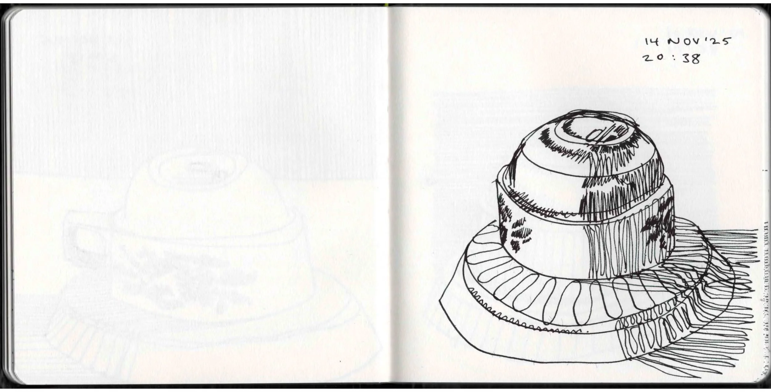 A black ink sketch of a cupcake with a swirl of frosting on top, drawn on a notebook page. The date '14 NOV 25' and time '20:38' are written at the top right corner.