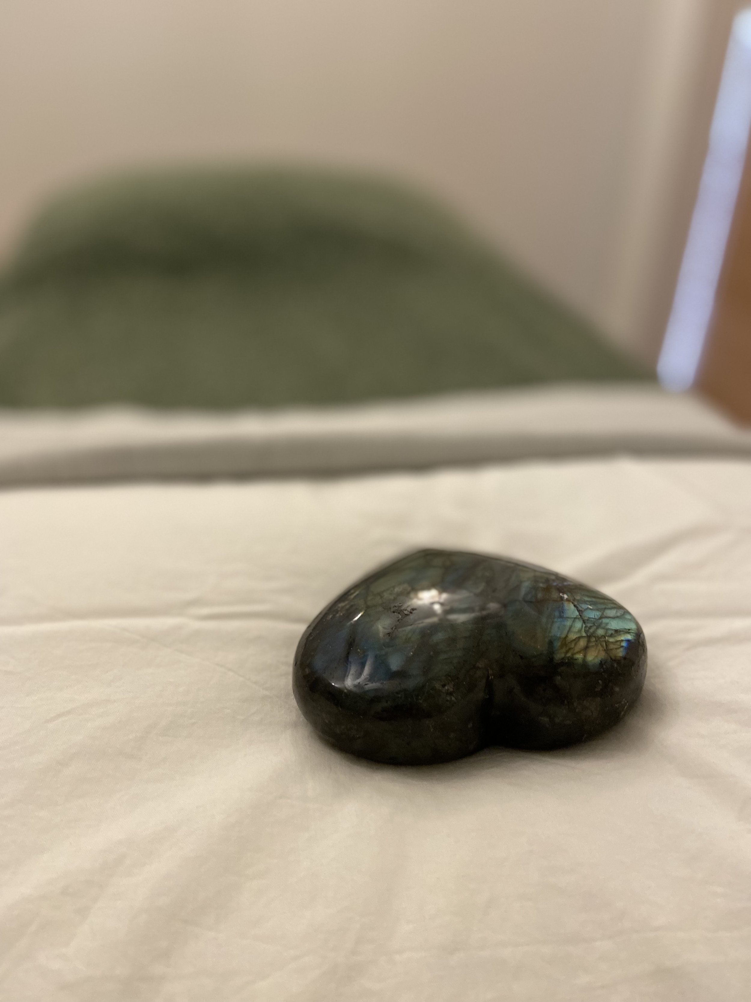 Reiki treatment table with healing stone at SEED Studio in Squamish